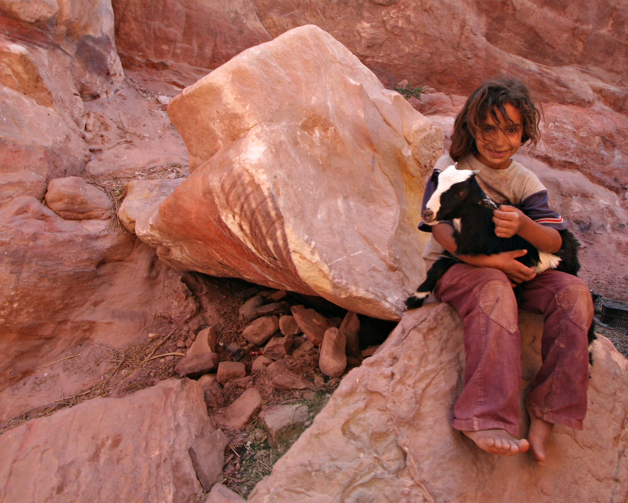bedouin girl with baby goat, petra, jordan