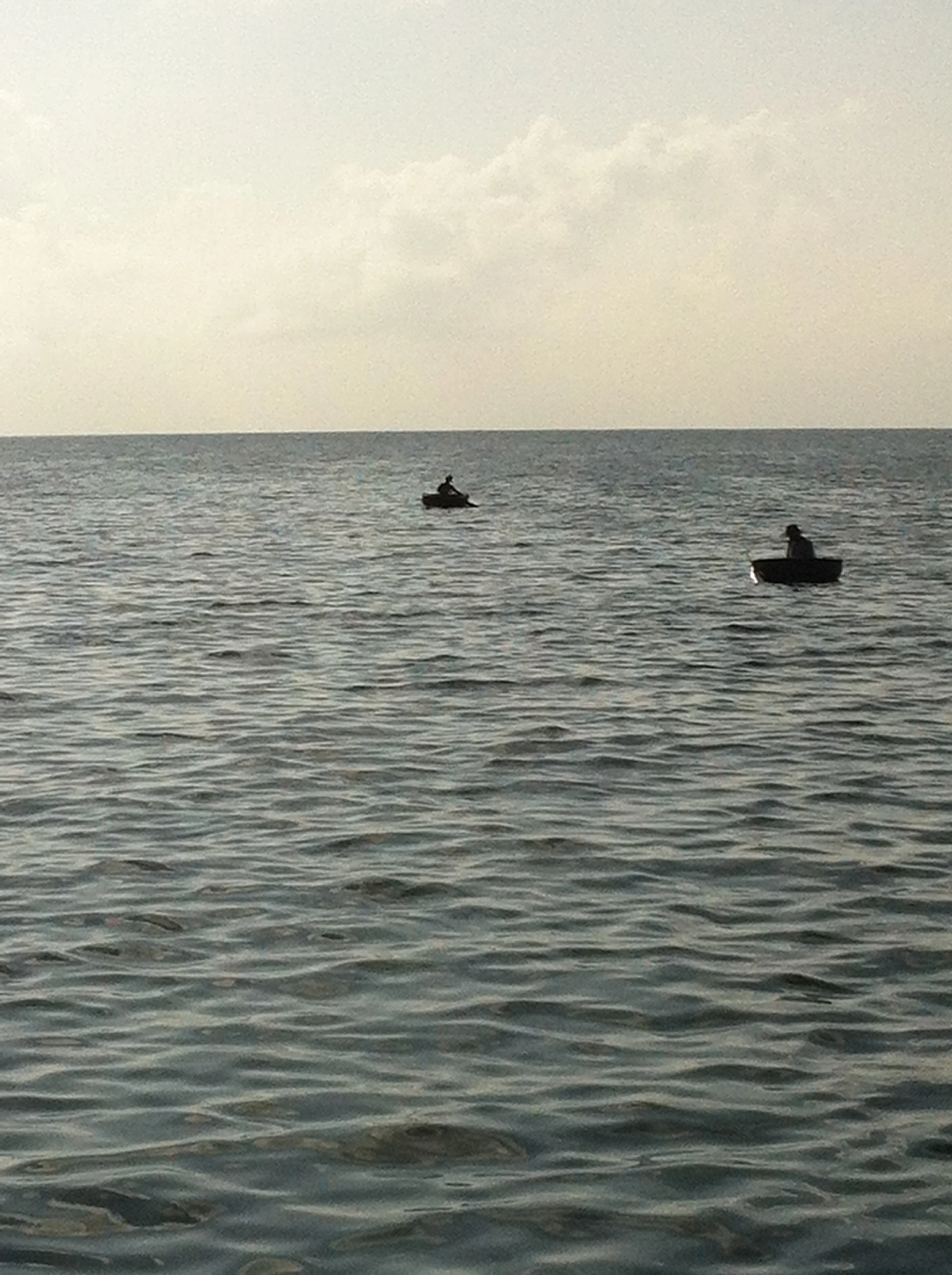 fishermen in tub boats, nha trang, vietnam