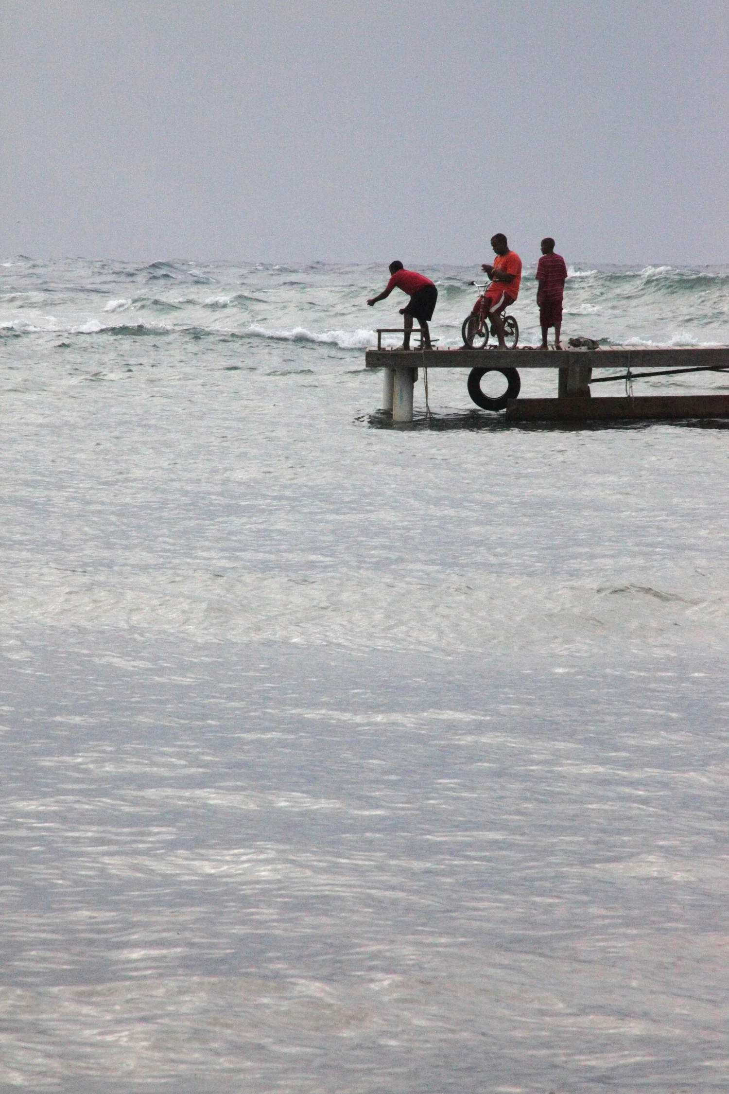 boys on dock, roatan, honduras