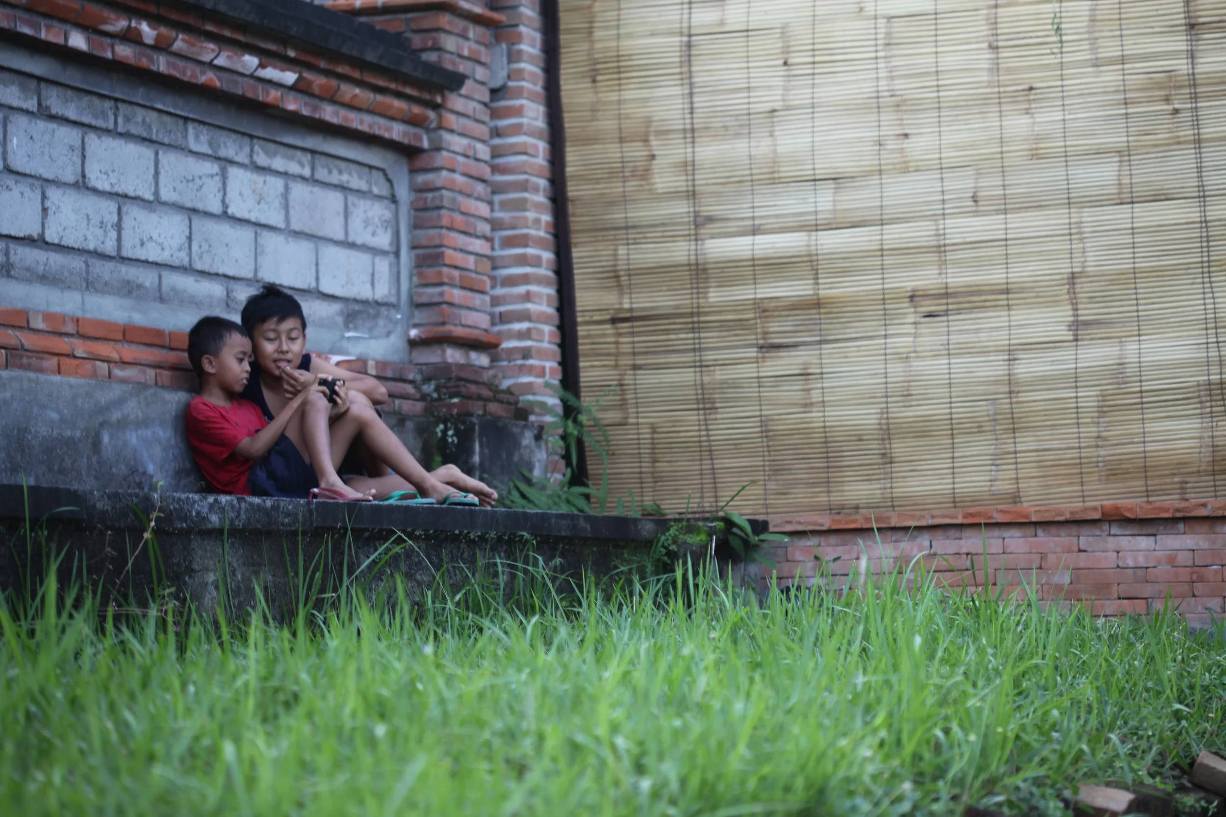 boys with game console, bali, indonesia