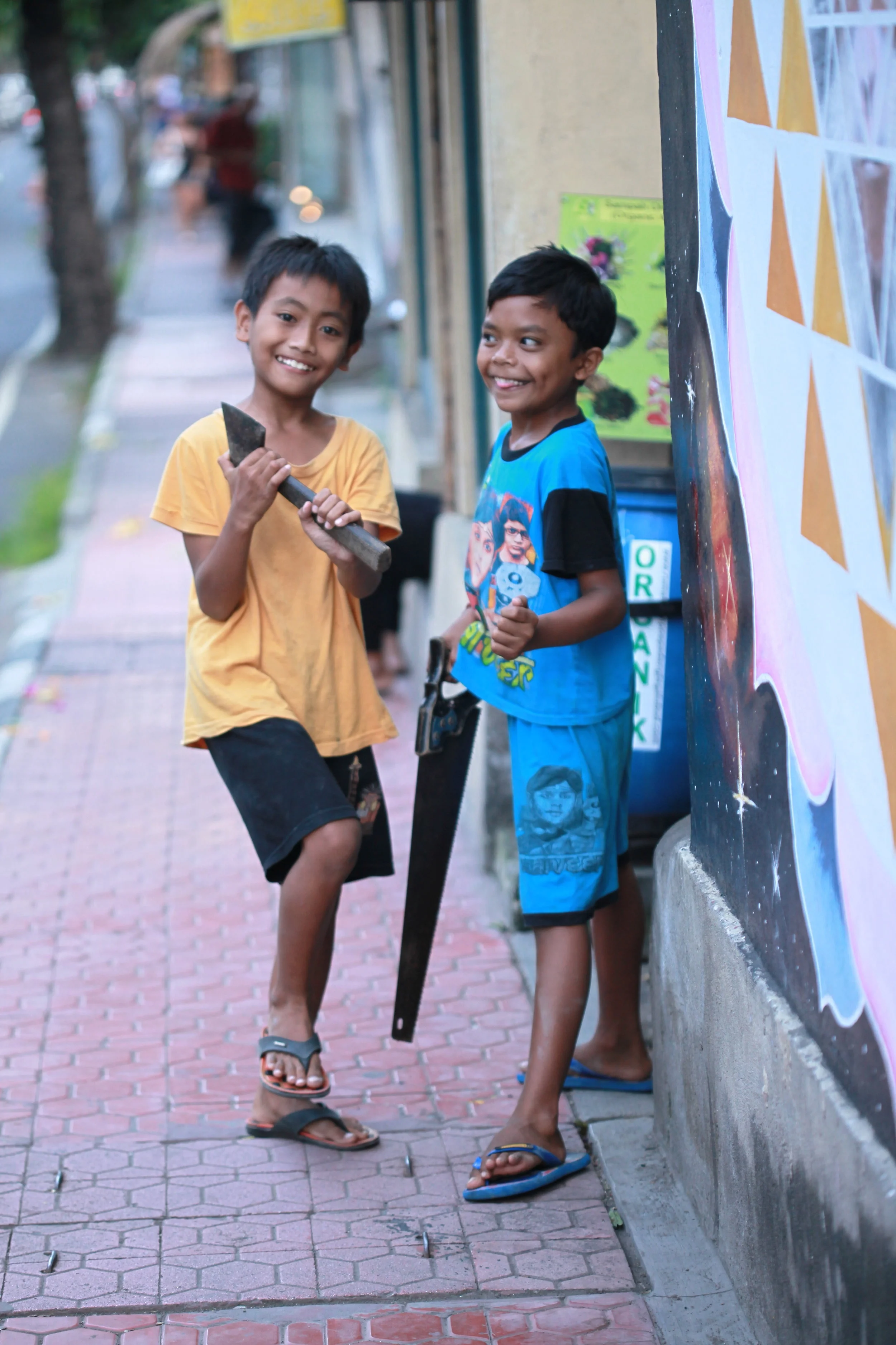 boys with construction tools, bali, indonesia