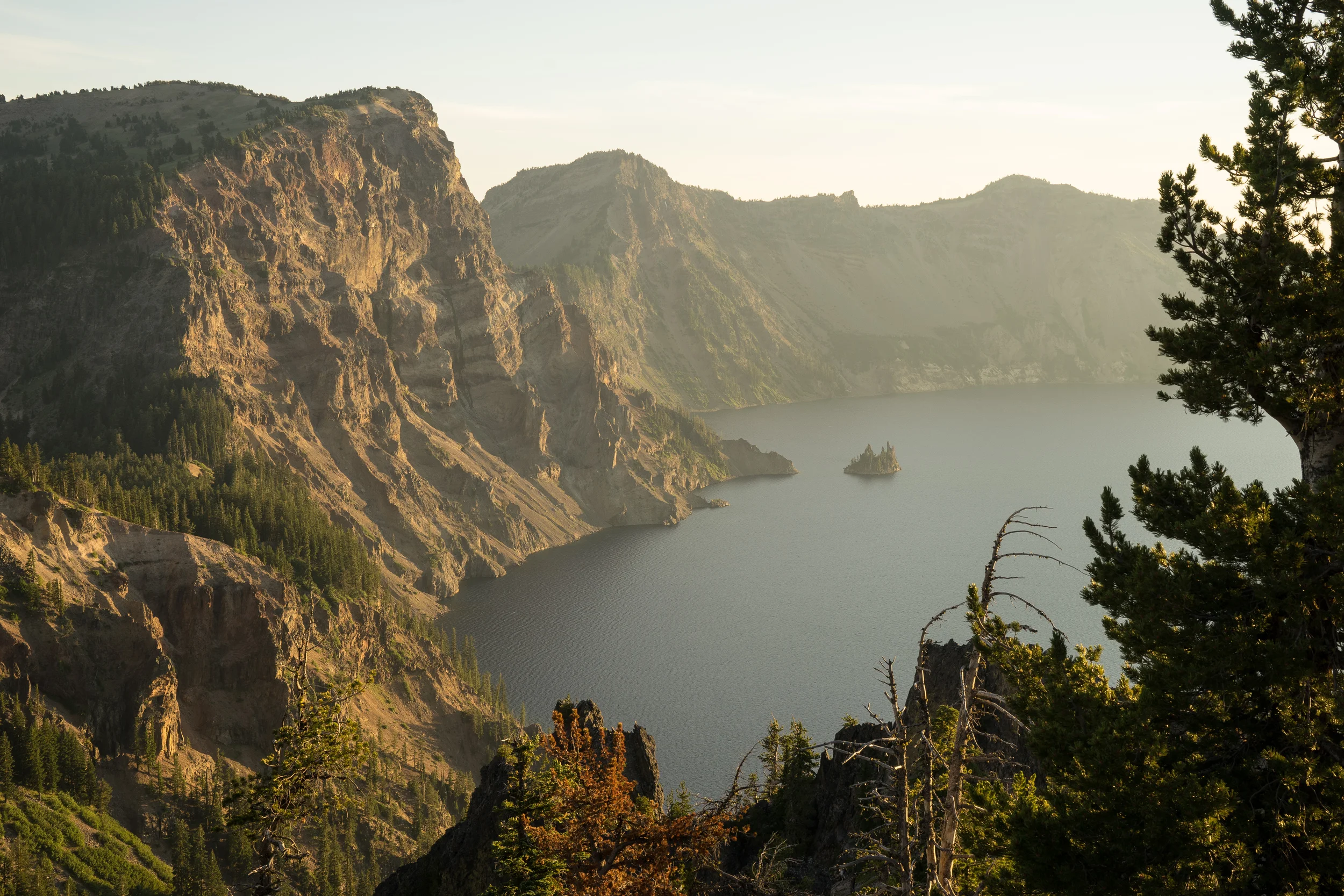 Located on the east rim of Crater Lake is the Phantom Ship . It got its name from the fact that it tends to appear and disappear in foggy weather like a ghost ship.