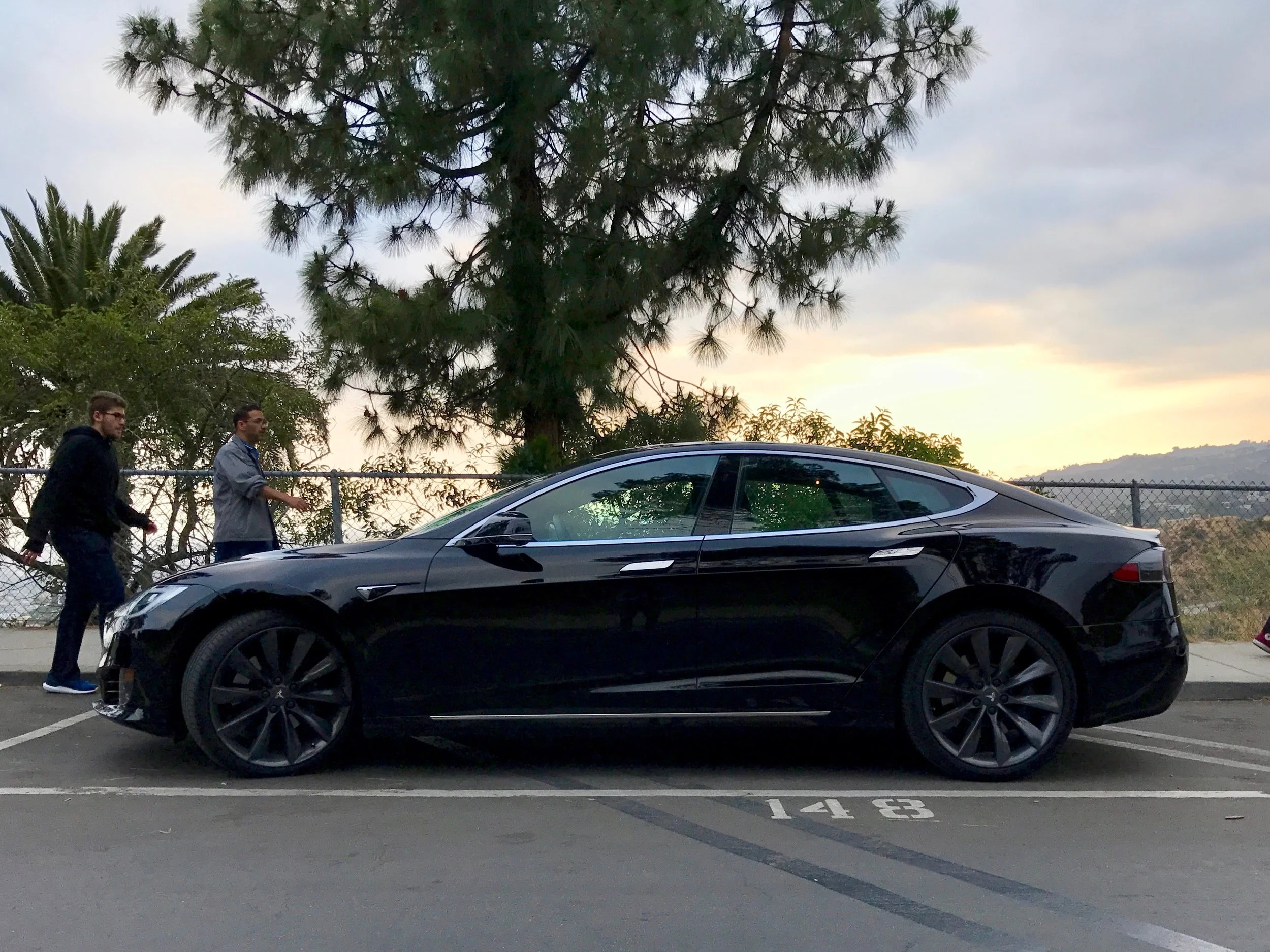 Sideview of the Model S against the sunset at the top of Griffith Park, Downtown Los Angeles.