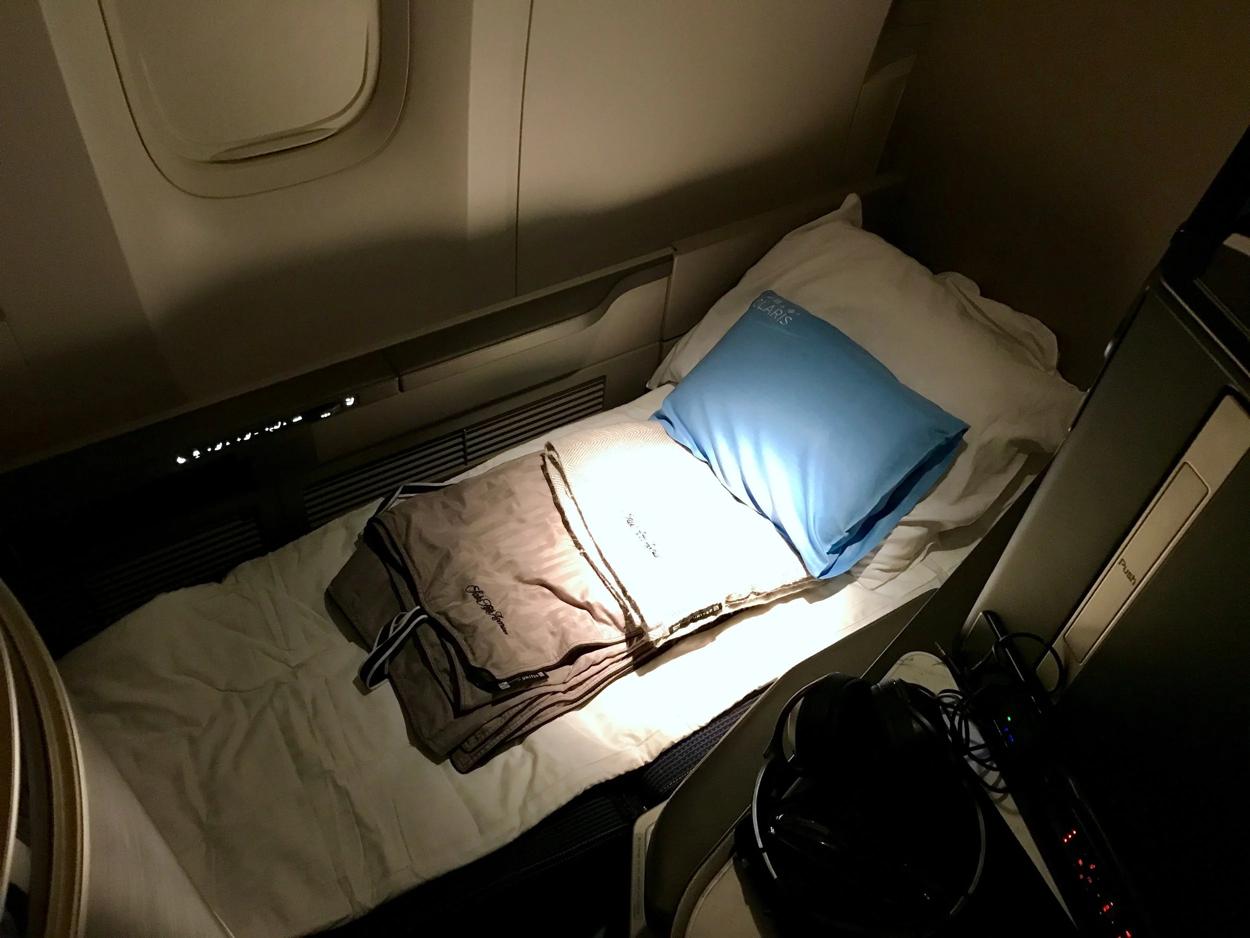 Time to sleep - the bed cover and blue gel pillow are not given to you unless you ask for them.