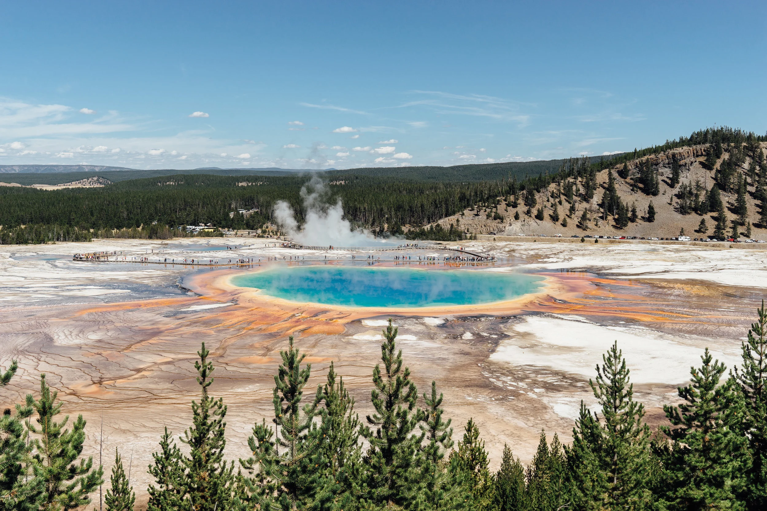 The Grand Prismatic Spring is the largest hot spring in the United States. The spring got its name from the rainbow-like coloration. This photo is taken from an overlook which is an easy 15 minute hike from the parking lot.