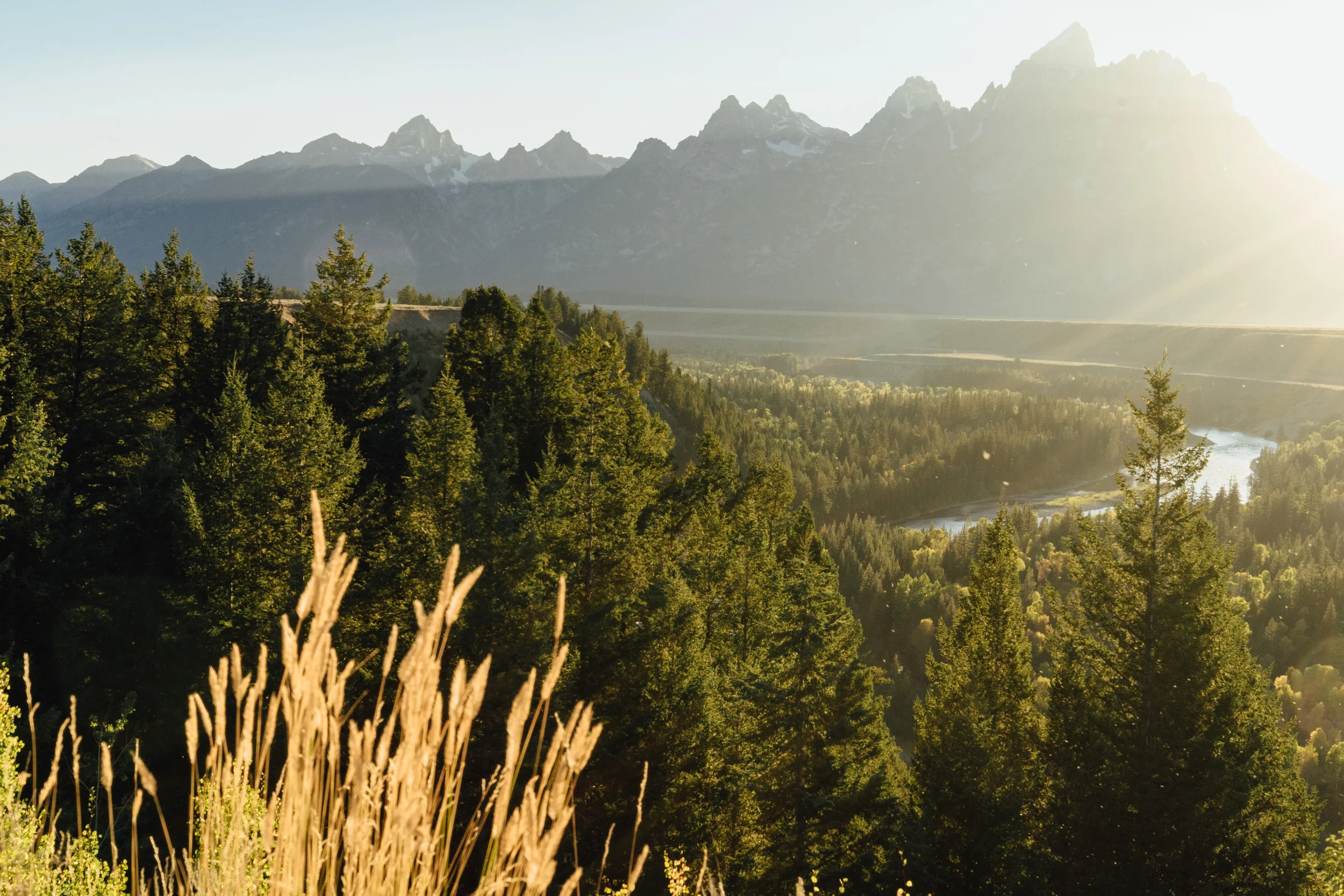 The Snake River winding in front of the Teton Range. This is location where Ansel Adams took his famous photograph .