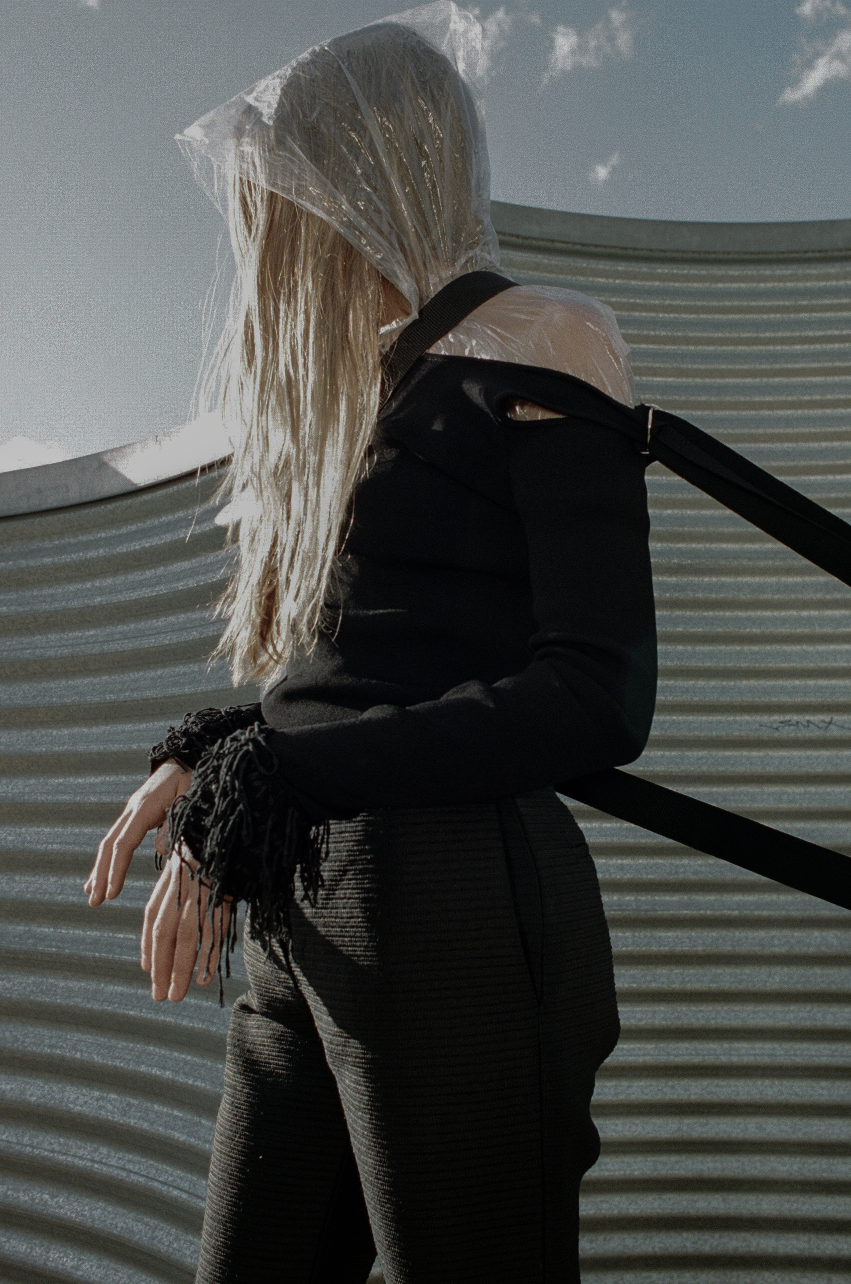 top + choker ALYX STUDIO , raincoat STYLIST'S OWN, trousers ELLERY, boots STOLEN GIRLFRIENDS CLUB