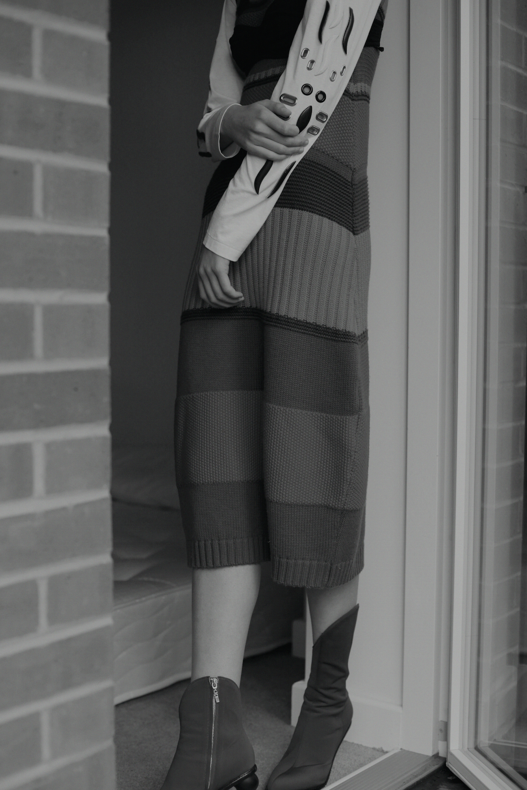 stripe knit dress ANGEL CHEN , top TOGA PULLA , bra DOLCE AND GABBANA, earrings JUSTINE CLENQUET, shoes ROBERT WUN 