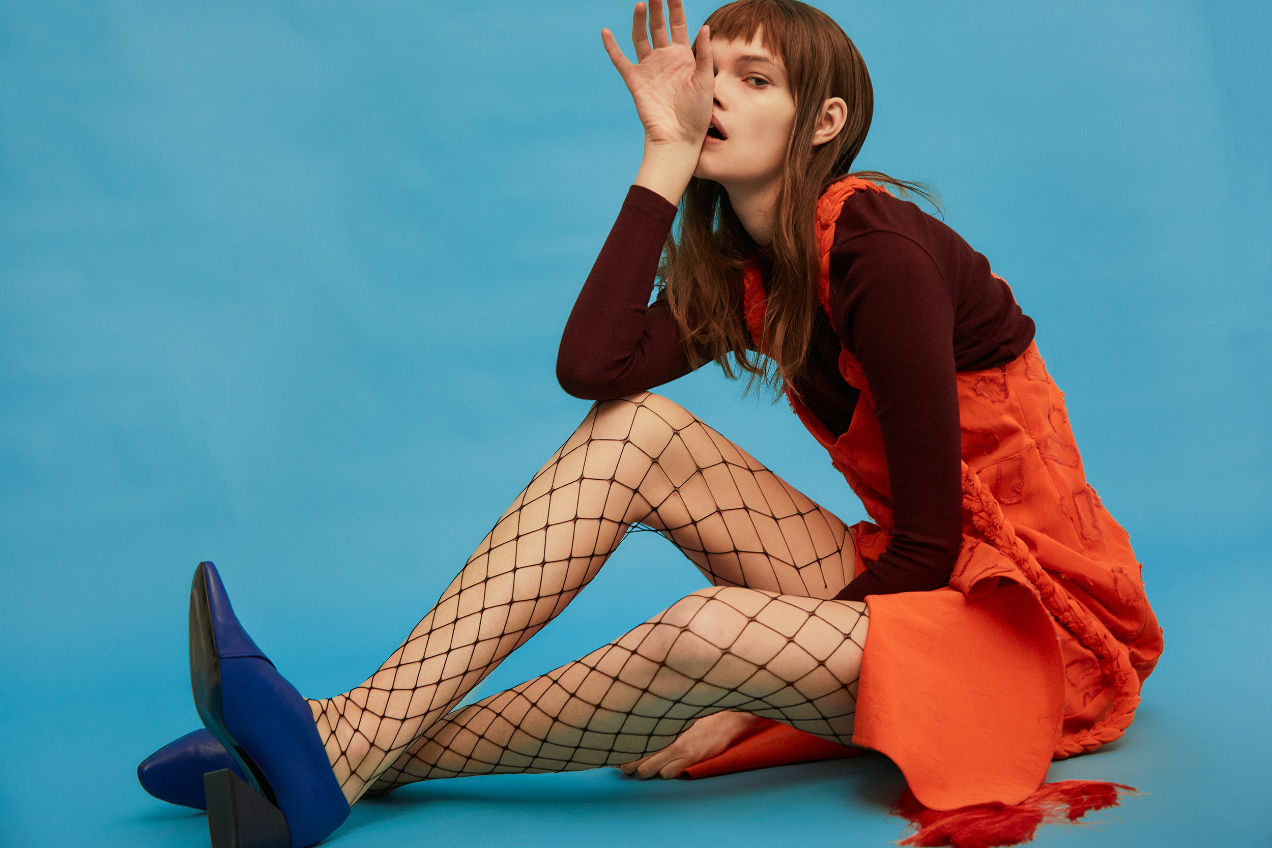 orange dress with plait straps: PINGHE , turtleneck top NORSE PROJECTS WOMEN , fishnet tights WOLFORD , cobalt leather shoes with black heel REJINA PYO X YUUL YIE
