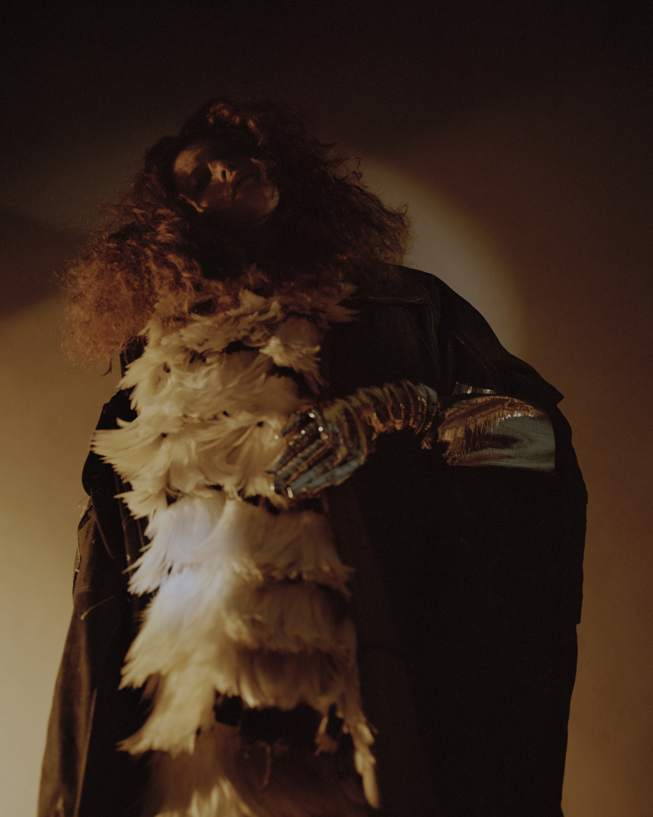 coat SAM THOMPSON , trousers (worn as scarf) VICTOR JIMENEZ TORRES, trousers ADAM JONES , gloves MAX LUO