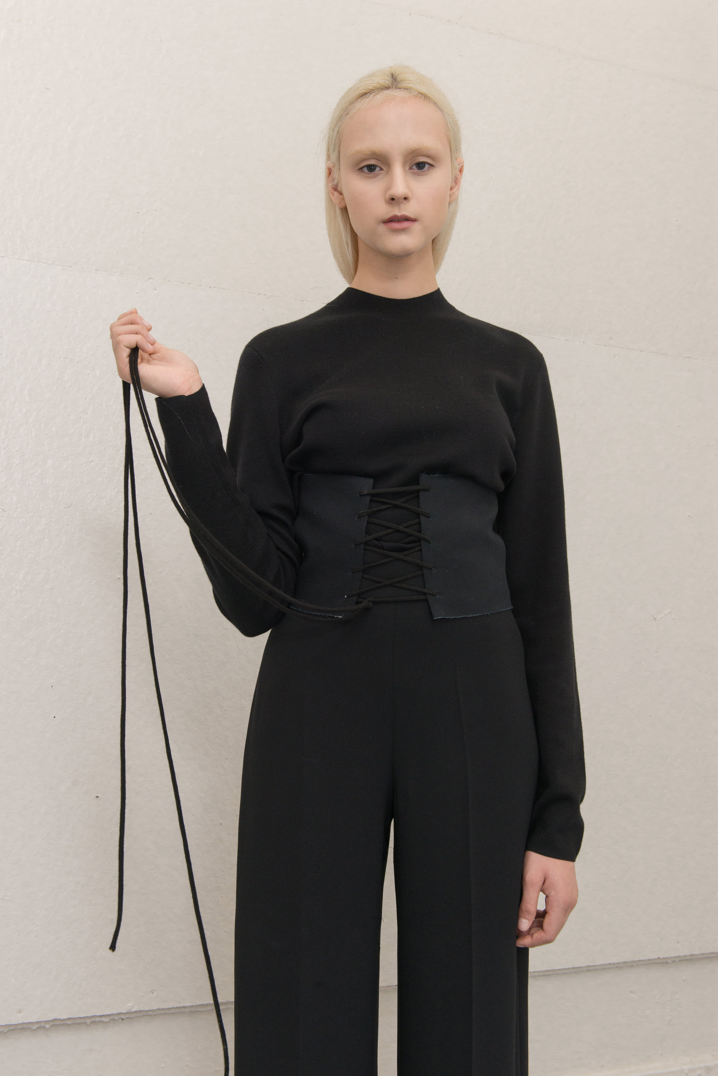 turtleneck COS, corset AI, pants THEORY, stocking WEST LOOP