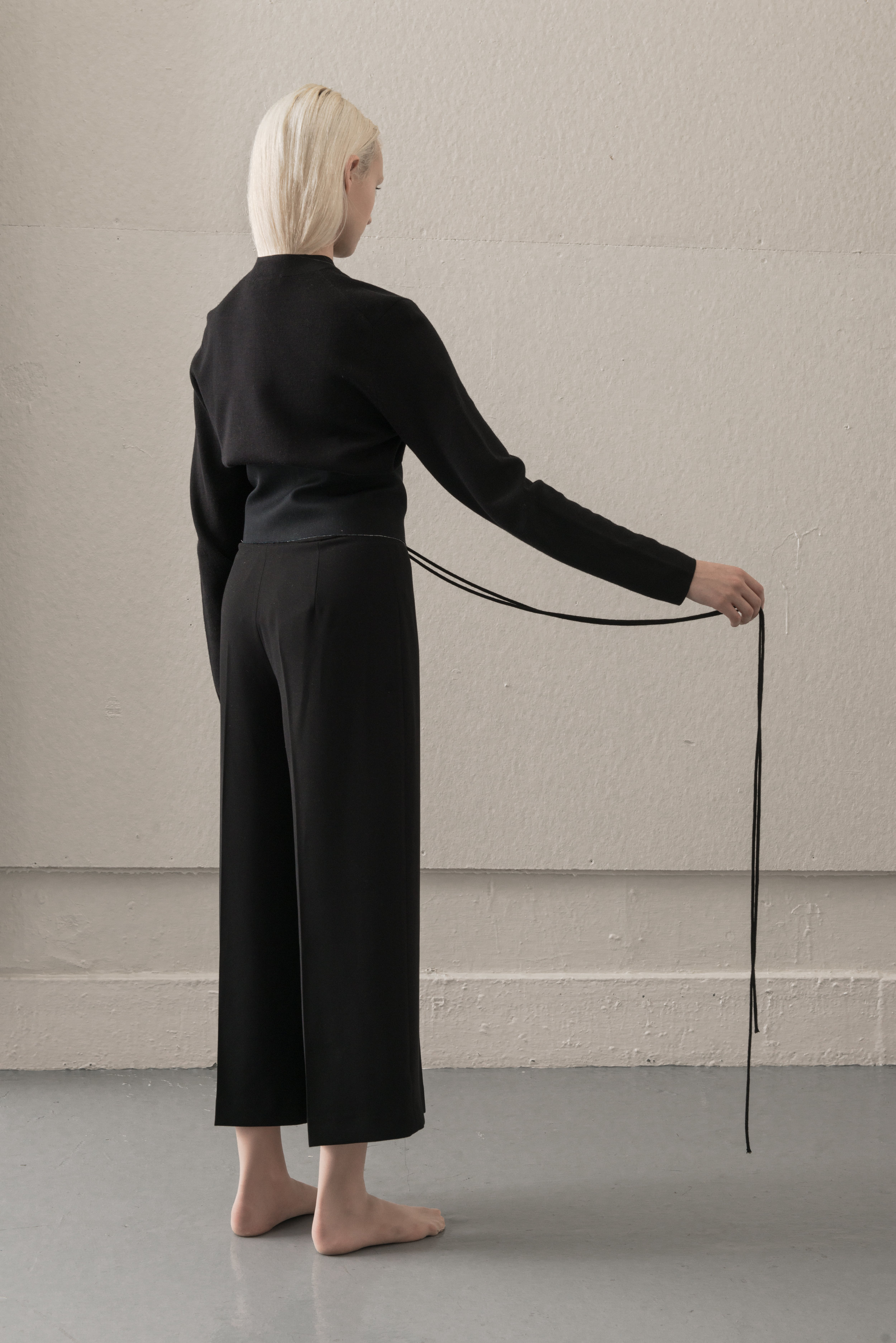 turtleneck COS, corset AI, pants THEORY, stocking WEST LOOP