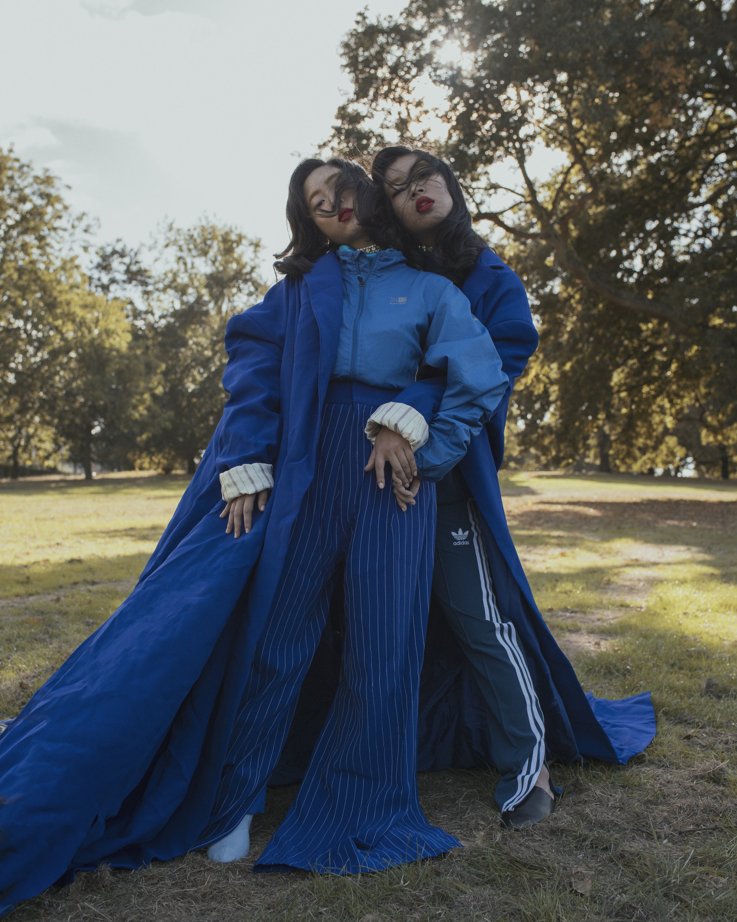 Yan wears top JOSEPH BOON, jacket KARIMOR, over-trousers VICTOR PATRICIO JIMENEZ TORRES, trousers MOTHER OF PEARL , choker KRYSTAL Joey wears full tracksuit ADIDAS , shoes SOL SANA , jacket VICTOR PATRICIO JIMENEZ TORRES