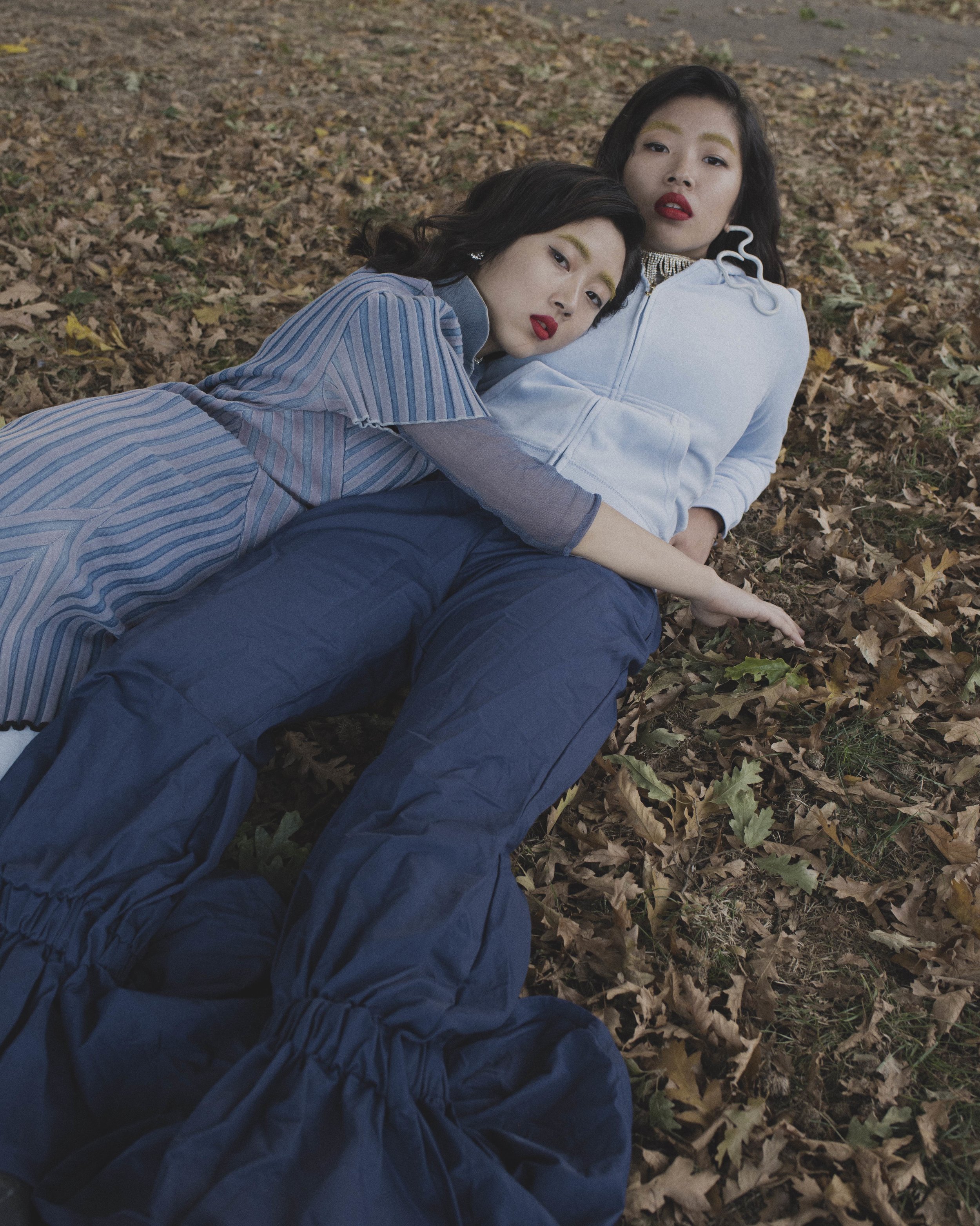 Yan wears trousers JUICY COUTURE , top CAMILLA MECACCI , dress HAAL , shoes DKNY , earring SWAROVSKI Joey wears hoodie JUICY COUTURE , trousers KIRA-JAYDEN MATTHEWS , shoes DKNY , earrings AUDREY MIFSUD , necklace VINTAGE