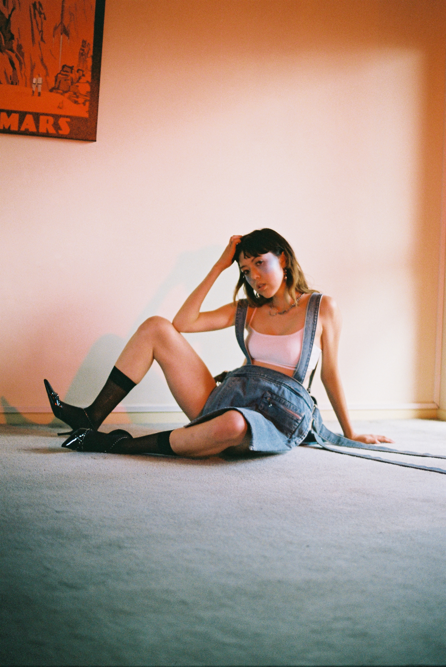 bralette MARIEYAT , apron AMBUSH , earrings JUSTINE CLENQUET , necklace AMANDA WHITESIDE, socks + shoes STYLIST'S OWN