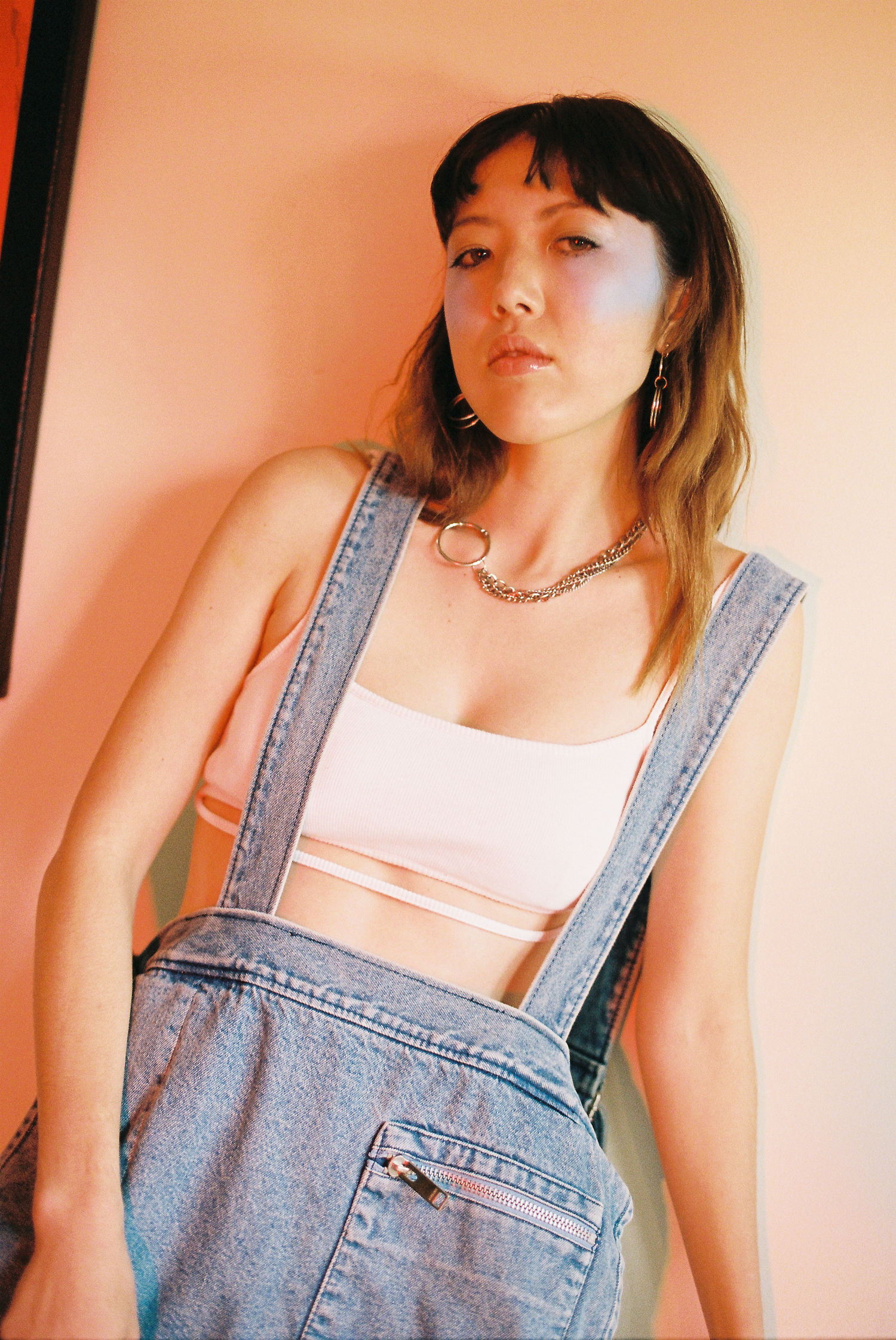 bralette MARIEYAT , apron AMBUSH , earrings JUSTINE CLENQUET , necklace AMANDA WHITESIDE, socks + shoes STYLIST'S OWN