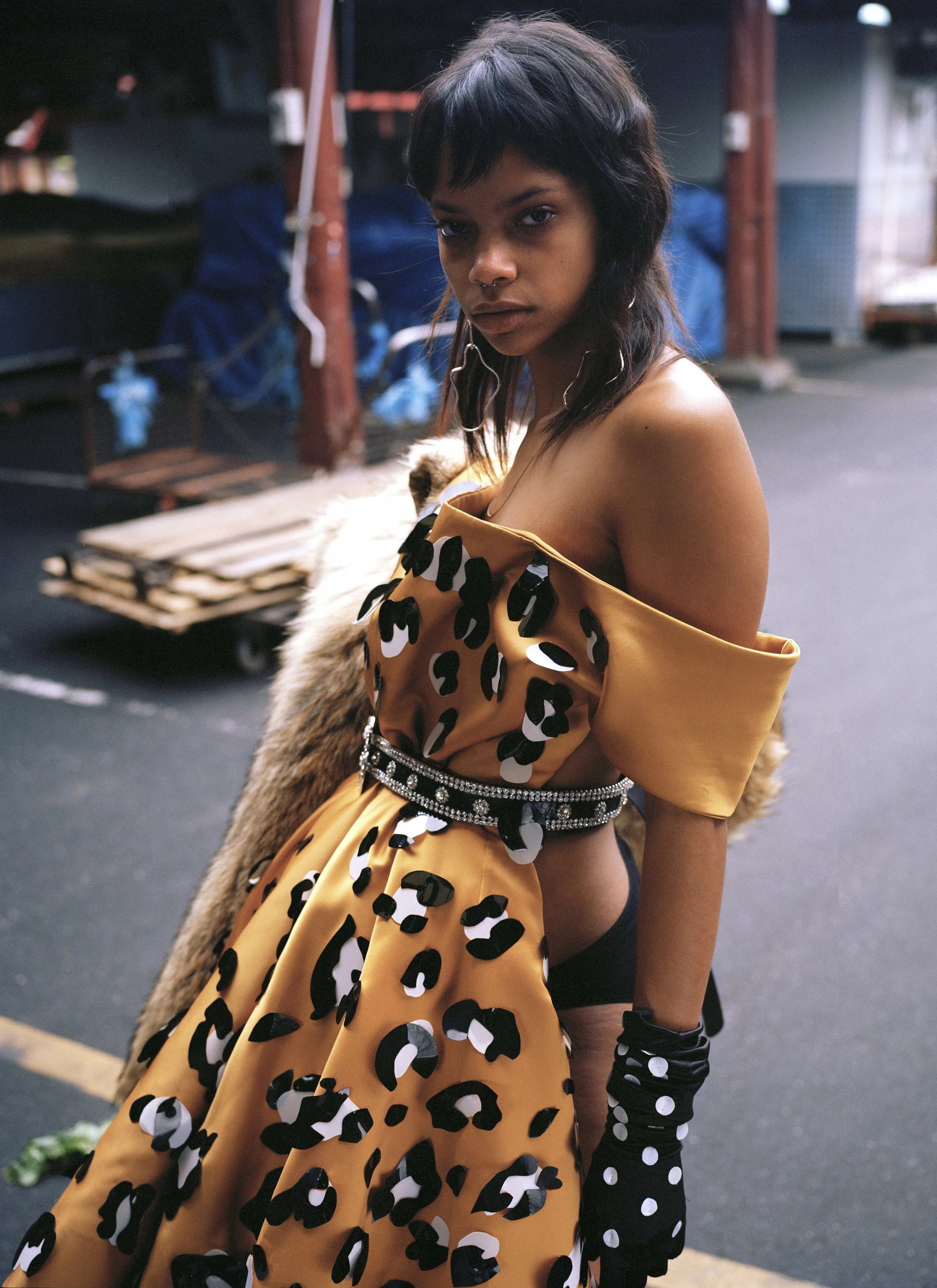 earrings HOLLY RYAN, belt STYLIST'S OWN, dress + gloves SARAH HOPE SCHOFIELD, jacket YESTERYEAR