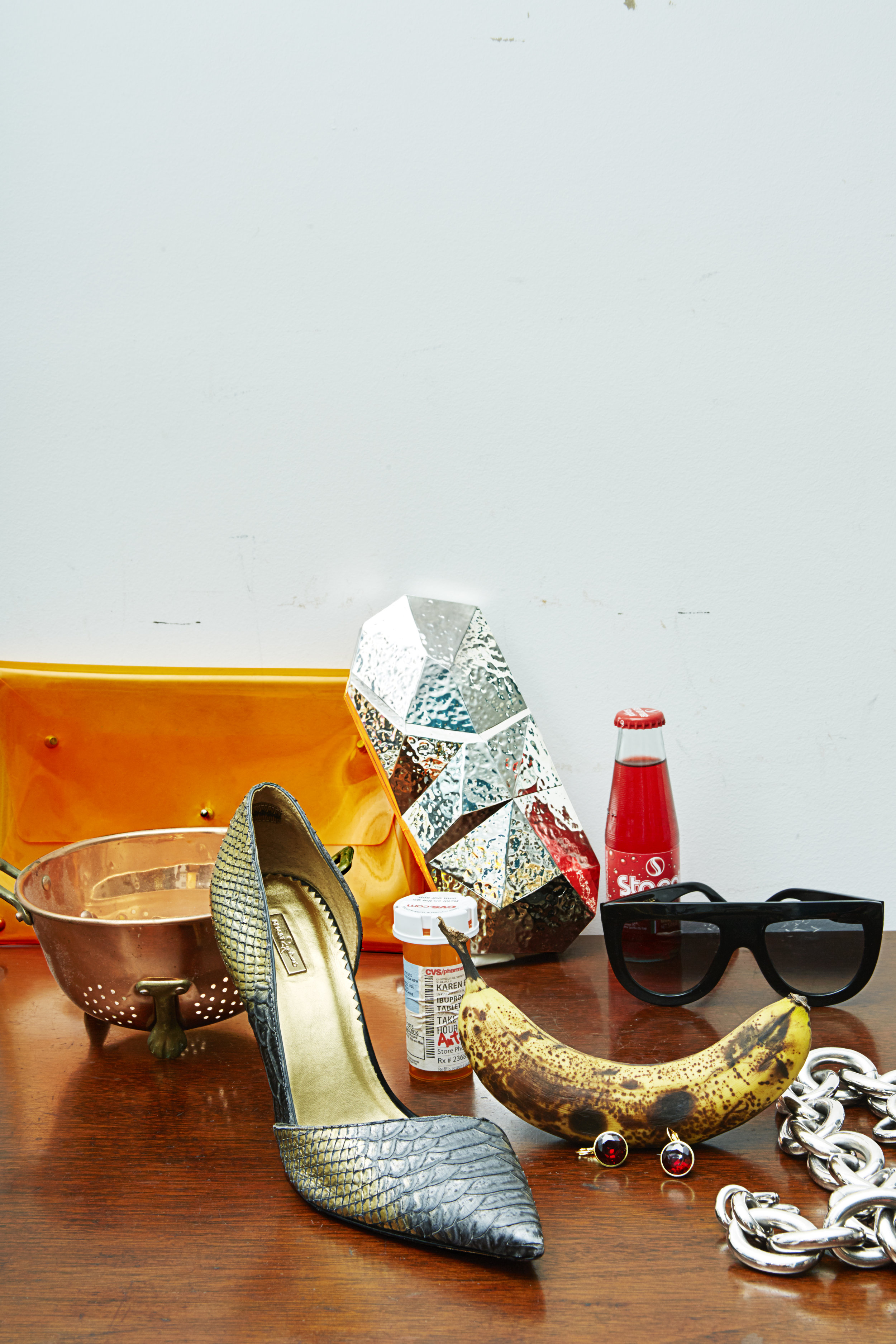 Orange clutch from OPENING CEREMONY Silver clutch by Refe , Sunglasses by Celine from NEIMAN MARCUS , Shoe by Report Signature , earrings + silver chain necklace STYLIST'S OWN