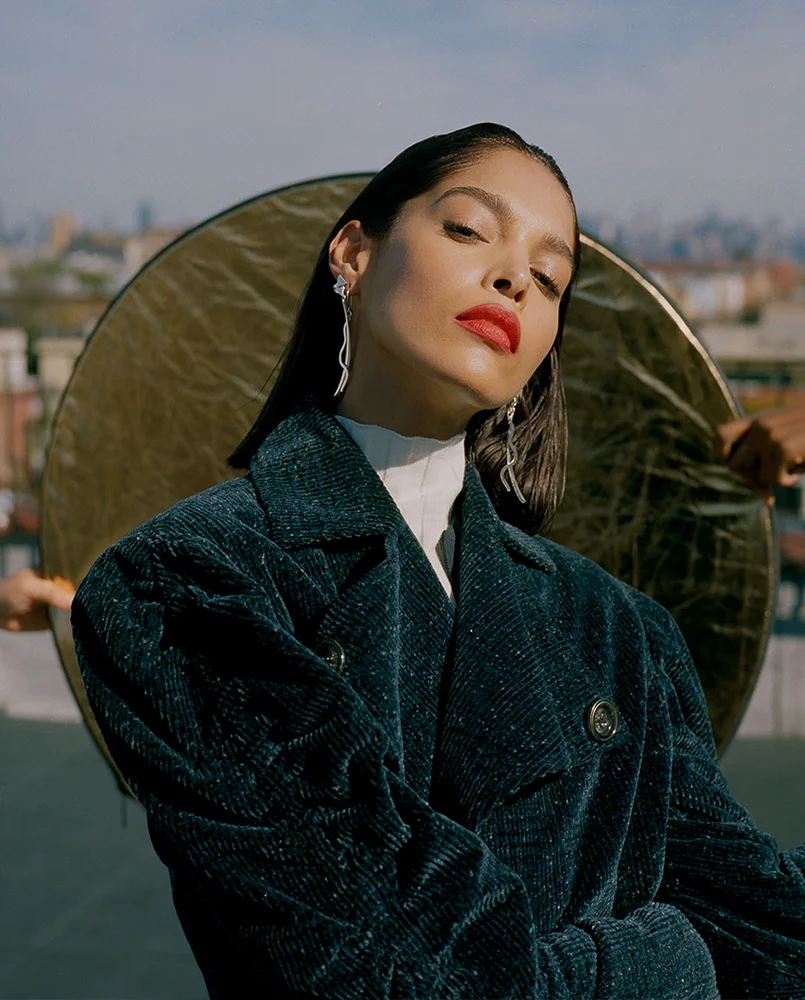 Coat by Claudia Li Top by Topshop Shoes by Tibi Earrings by Lady Grey