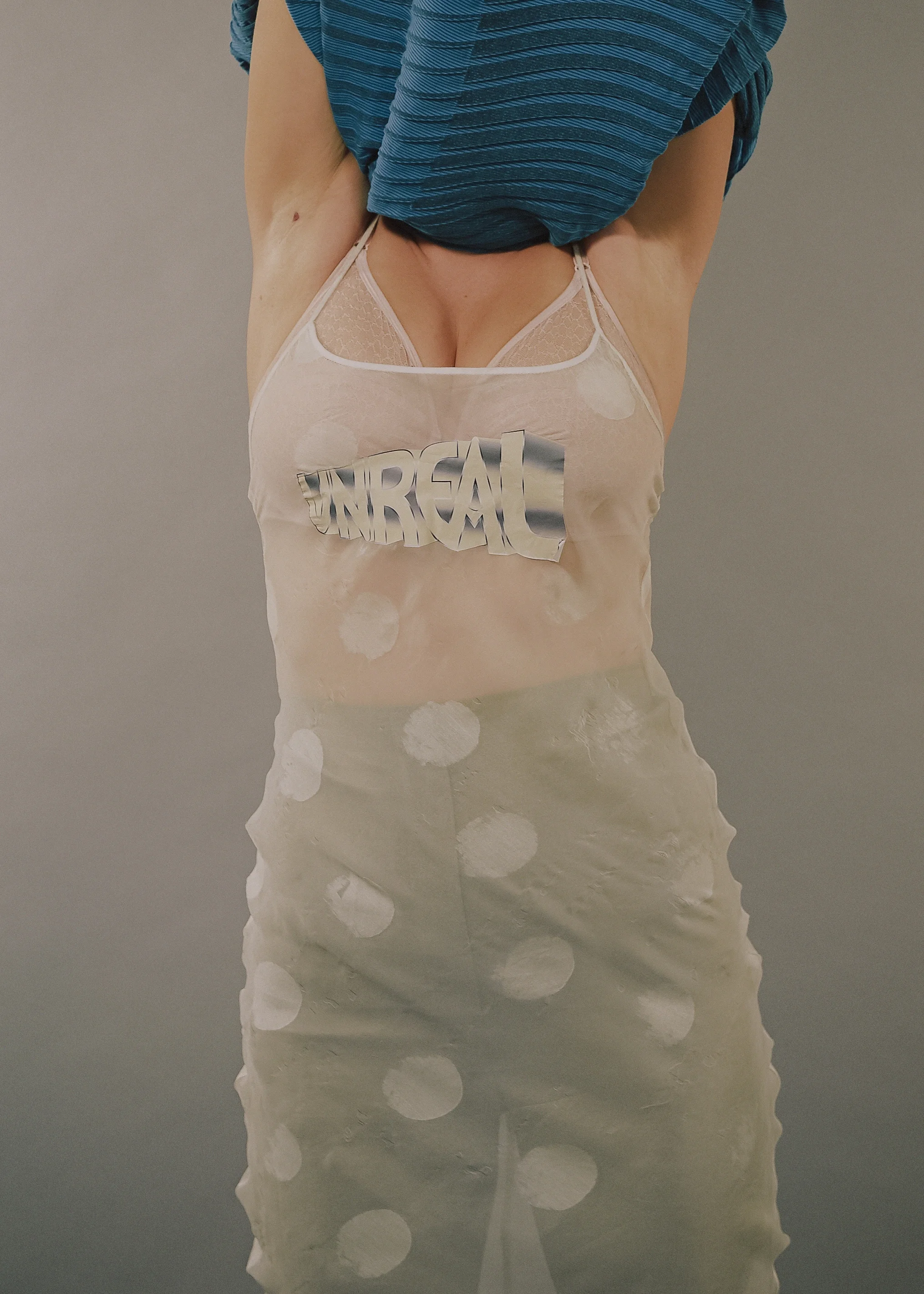 top Issey Miyake, bra model's own, dress Anne Sofie Madsen, trousers Acne