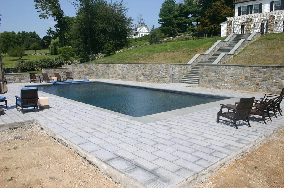 Ref ID - 44 custom stone steps leading to a 50 foot pool with retaining walls and 1800 square feet of patio in Greenwich, CT