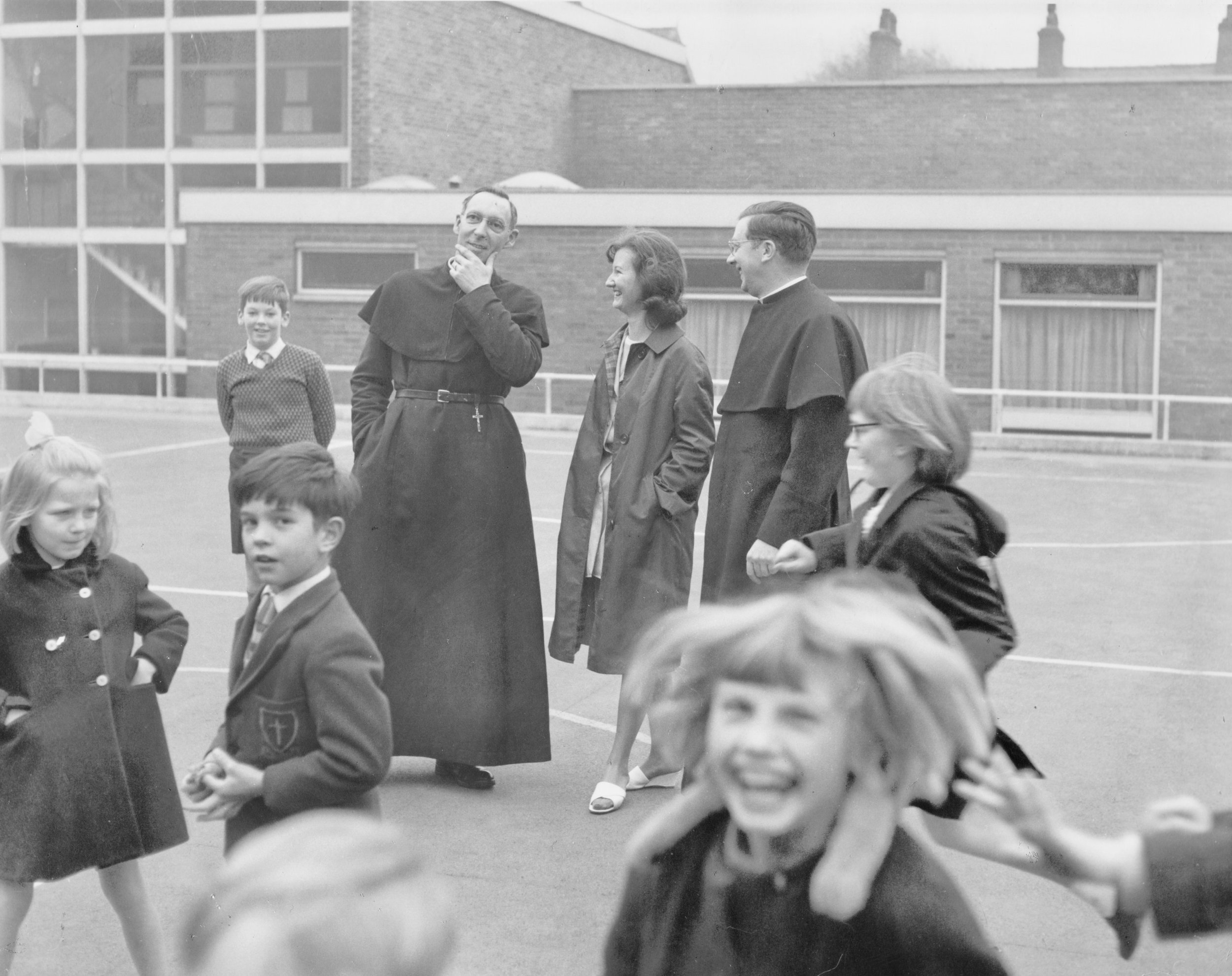 The day the new school opened 13th September 1964, on of the Assistant Curates, Fr Ken Wood; one of the teachers, Miss Gloria Davies and the Rector Fr J.M. Titterington.