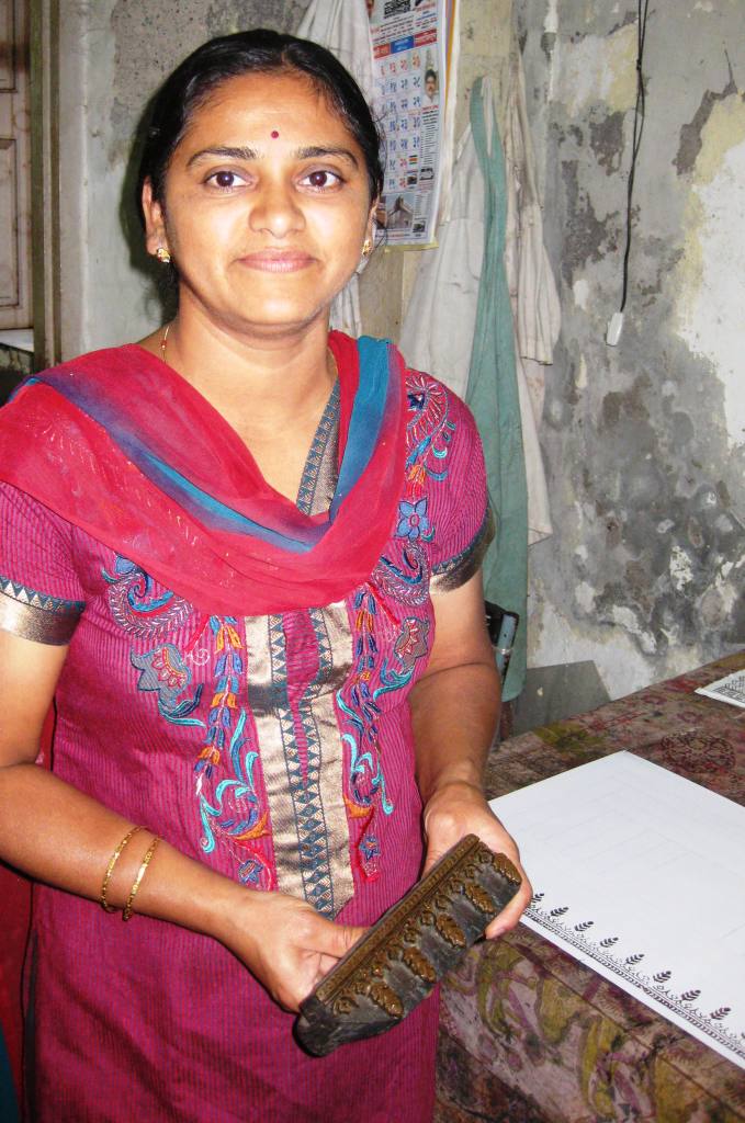 A young woman trains in block printing techniques at the Weaver’s Service Center in Bombay.