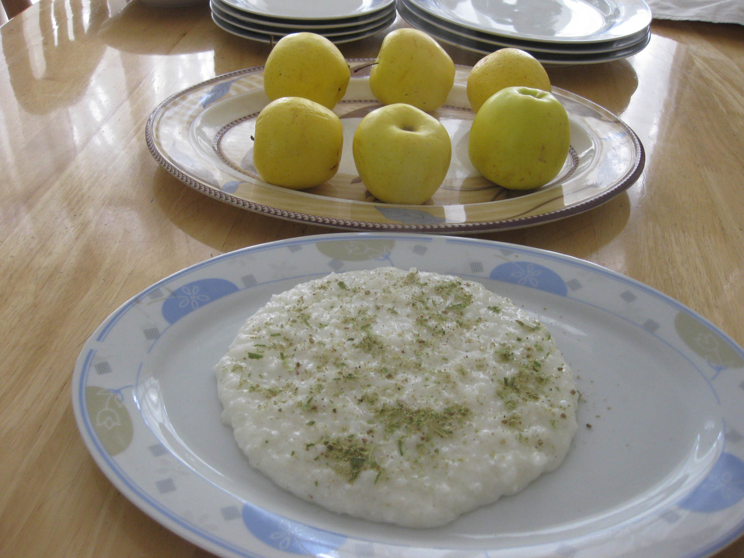Rice pudding dotted with crushed cardamom.