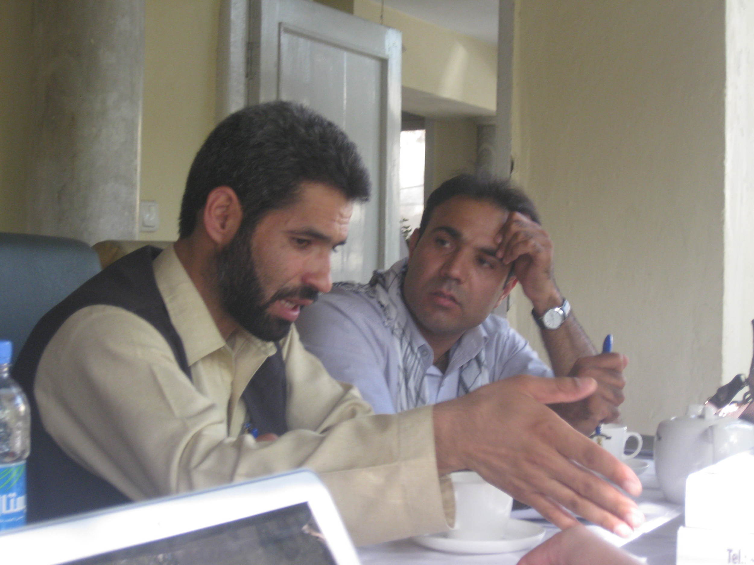 Zabiullah and Arman discuss things. Arman (right) has an amazing voice and sang some verses of the Koran as an auspicious opening for our workshop. He also showed me his Afghan pop music video!