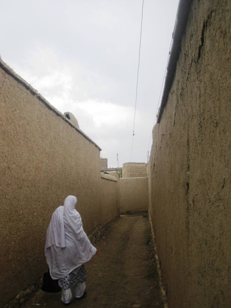 Nouria walks ahead.