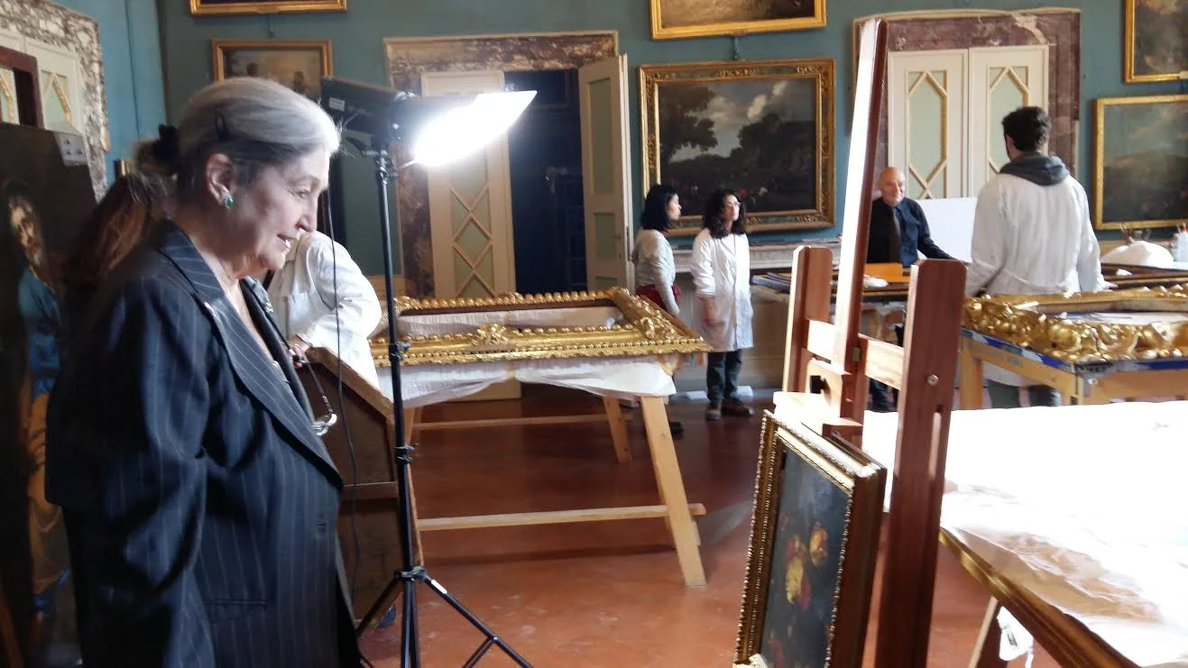 La fondatrice di AWA Jane Fortune in un deposito di Palazzo Pitti mentre ammira il quadro della Oosterwyck
Normal
0
14
false
false
false
IT
X-NONE
X-NONE
/* Style Definitions */
table.MsoNormalTable
{mso-style-name:"Tabella normale";
mso-tstyle-rowband-size:0;
mso-tstyle-colband-size:0;
mso-style-noshow:yes;
mso-style-priority:99;
mso-style-qformat:yes;
mso-style-parent:"";
mso-padding-alt:0cm 5.4pt 0cm 5.4pt;
mso-para-margin-top:0cm;
mso-para-margin-right:0cm;
mso-para-margin-bottom:10.0pt;
mso-para-margin-left:0cm;
mso-pagination:widow-orphan;
font-size:11.0pt;
font-family:"Cambria","serif";
mso-ascii-font-family:Cambria;
mso-ascii-theme-font:minor-latin;
mso-fareast-font-family:"Times New Roman";
mso-fareast-theme-font:minor-fareast;
mso-hansi-font-family:Cambria;
mso-hansi-theme-font:minor-latin;}
Normal
0
14
false
false
false
IT
X-NONE
X-NONE
/* Style Definitions */
table.MsoNormalTable
{mso-style-name:"Tabella normale";
mso-tstyle-rowband-size:0;
mso-tstyle-colband-size:0;
mso-style-noshow:yes;
mso-style-priority:99;
mso-style-qformat:yes;
mso-style-parent:"";
mso-padding-alt:0cm 5.4pt 0cm 5.4pt;
mso-para-margin-top:0cm;
mso-para-margin-right:0cm;
mso-para-margin-bottom:10.0pt;
mso-para-margin-left:0cm;
mso-pagination:widow-orphan;
font-size:11.0pt;
font-family:"Cambria","serif";
mso-ascii-font-family:Cambria;
mso-ascii-theme-font:minor-latin;
mso-fareast-font-family:"Times New Roman";
mso-fareast-theme-font:minor-fareast;
mso-hansi-font-family:Cambria;
mso-hansi-theme-font:minor-latin;}
Normal
0
14
false
false
false
IT
X-NONE
X-NONE
/* Style Definitions */
table.MsoNormalTable
{mso-style-name:"Tabella normale";
mso-tstyle-rowband-size:0;
mso-tstyle-colband-size:0;
mso-style-noshow:yes;
mso-style-priority:99;
mso-style-qformat:yes;
mso-style-parent:"";
mso-padding-alt:0cm 5.4pt 0cm 5.4pt;
mso-para-margin:0cm;
mso-para-margin-bottom:.0001pt;
mso-pagination:widow-orphan;
font-size:11.0pt;
font-family:"Calibri","sans-serif";
mso-ascii-font-family:Calibri;
mso-ascii-theme-font:minor-latin;
mso-fareast-font-family:"Times New Roman";
mso-fareast-theme-font:minor-fareast;
mso-hansi-font-family:Calibri;
mso-hansi-theme-font:minor-latin;}
Normal
0
14
false
false
false
IT
X-NONE
X-NONE
/* Style Definitions */
table.MsoNormalTable
{mso-style-name:"Tabella normale";
mso-tstyle-rowband-size:0;
mso-tstyle-colband-size:0;
mso-style-noshow:yes;
mso-style-priority:99;
mso-style-qformat:yes;
mso-style-parent:"";
mso-padding-alt:0cm 5.4pt 0cm 5.4pt;
mso-para-margin:0cm;
mso-para-margin-bottom:.0001pt;
mso-pagination:widow-orphan;
font-size:11.0pt;
font-family:"Calibri","sans-serif";
mso-ascii-font-family:Calibri;
mso-ascii-theme-font:minor-latin;
mso-fareast-font-family:"Times New Roman";
mso-fareast-theme-font:minor-fareast;
mso-hansi-font-family:Calibri;
mso-hansi-theme-font:minor-latin;}