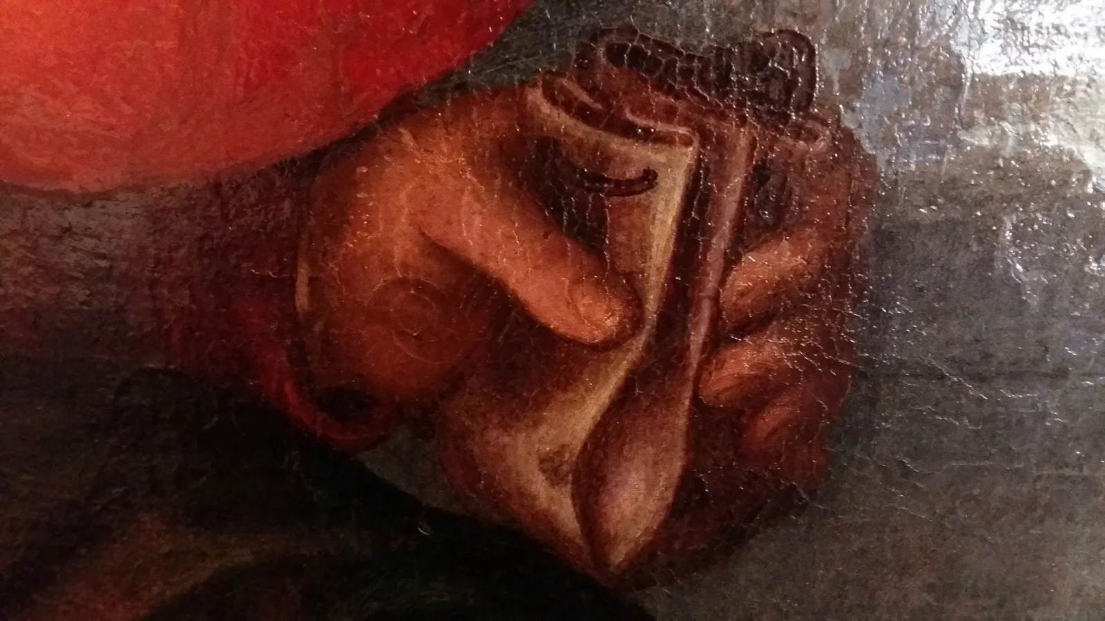 Giuda stringe la borsa ricamata con il denaro