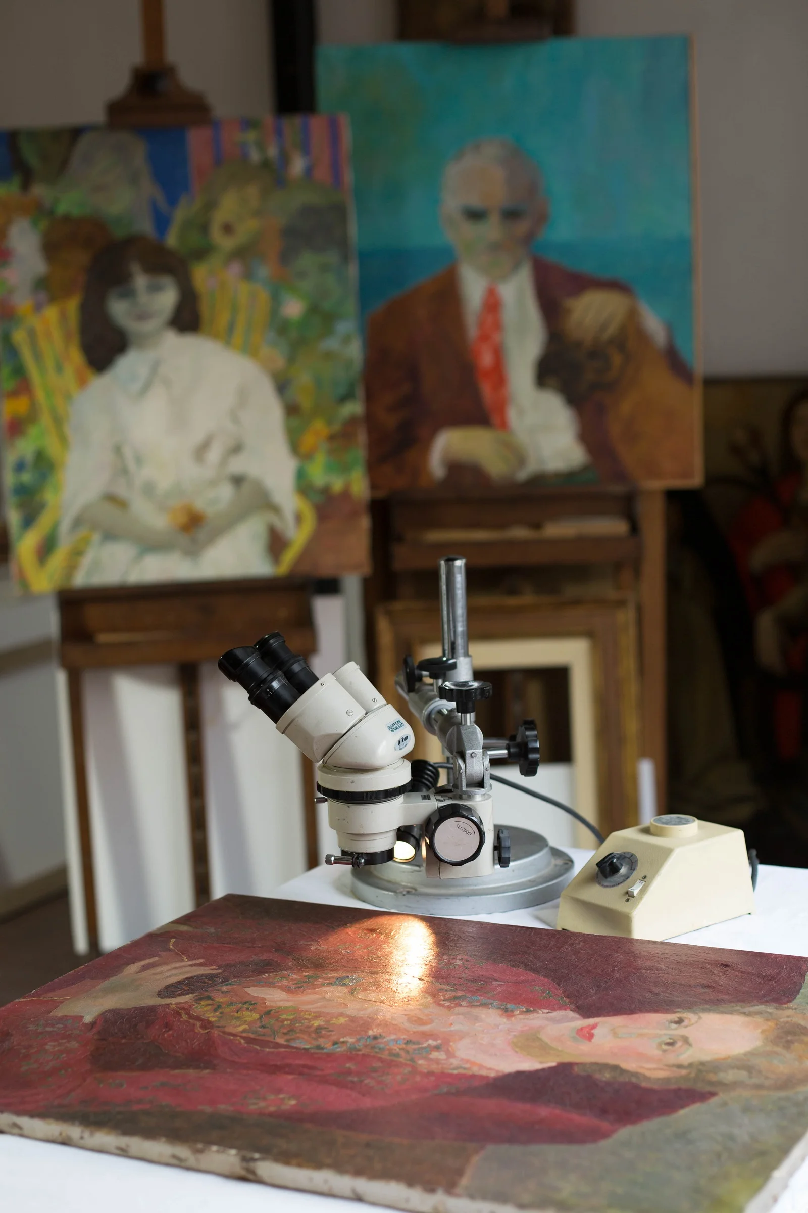 Manzini's portrait among other greats at the restoration studio: Morante and Moravia.