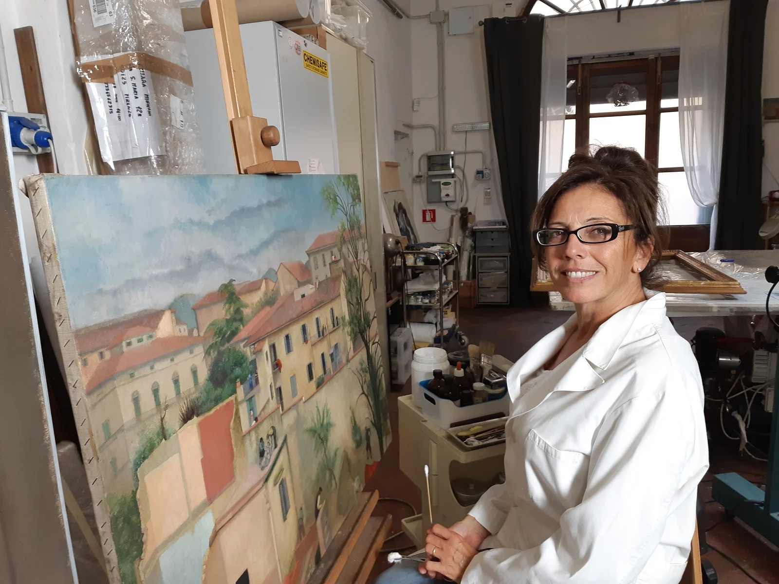 Restorer Sandra Pucci with Levasti's painting