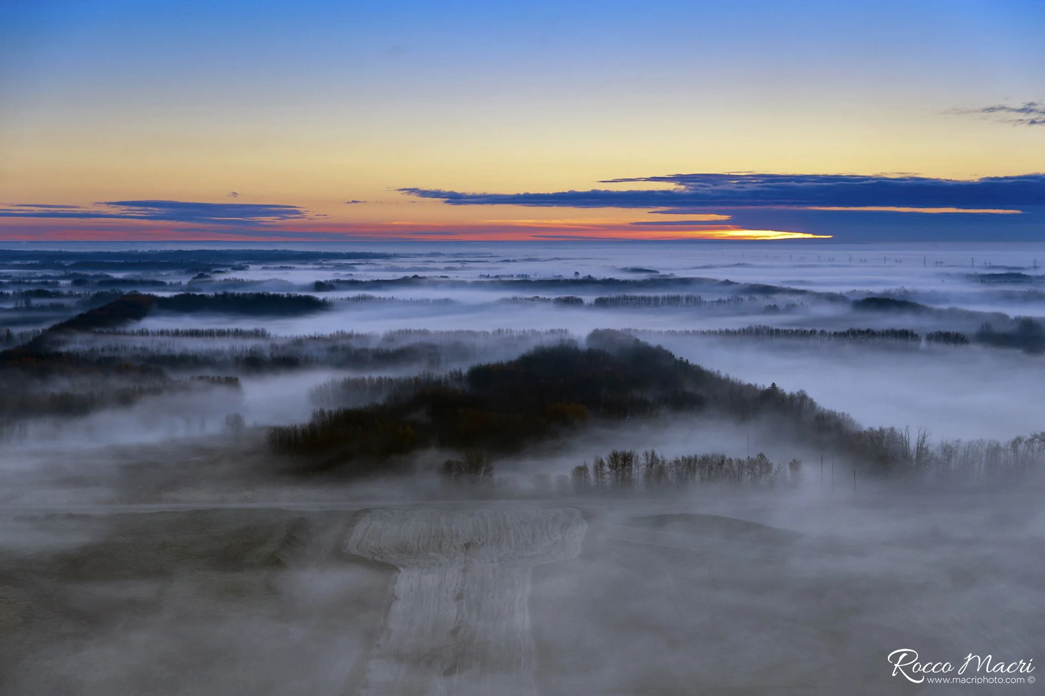 Foggy sunrise from the air. Spruce Grove, Alberta.