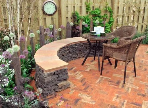 Reclaimed brick patio in modern garden. Designer: Mark Hanlon Image: Yorkshire Times.