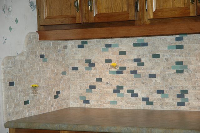 a combination of custom blended glass and natural stone tile 