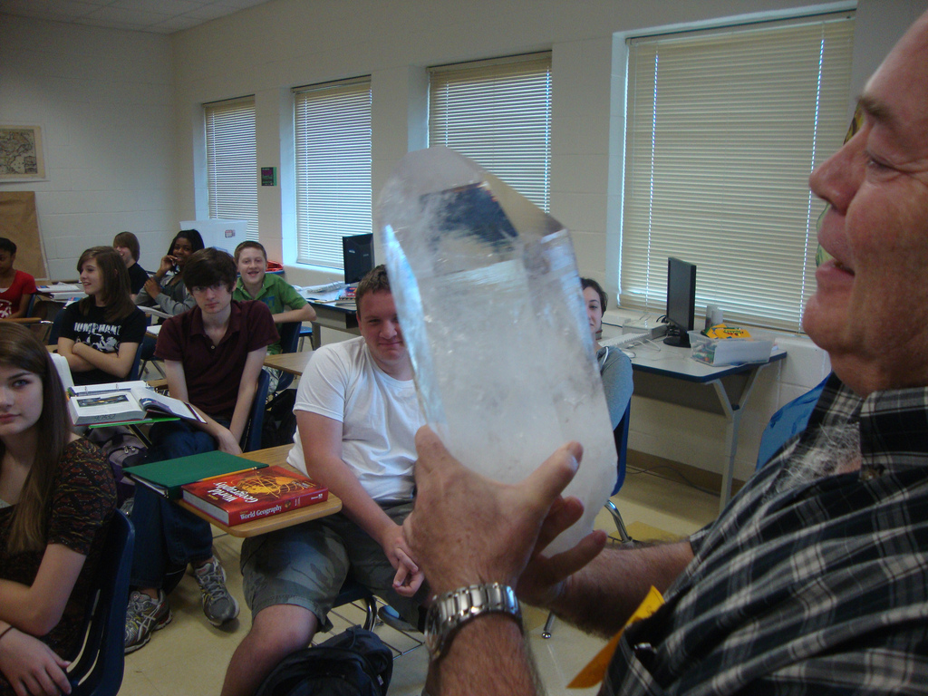 SGS Member Dr. Mike Roberts shows a quartz crystal to a class of freshmen at Caddo Magnet High School.