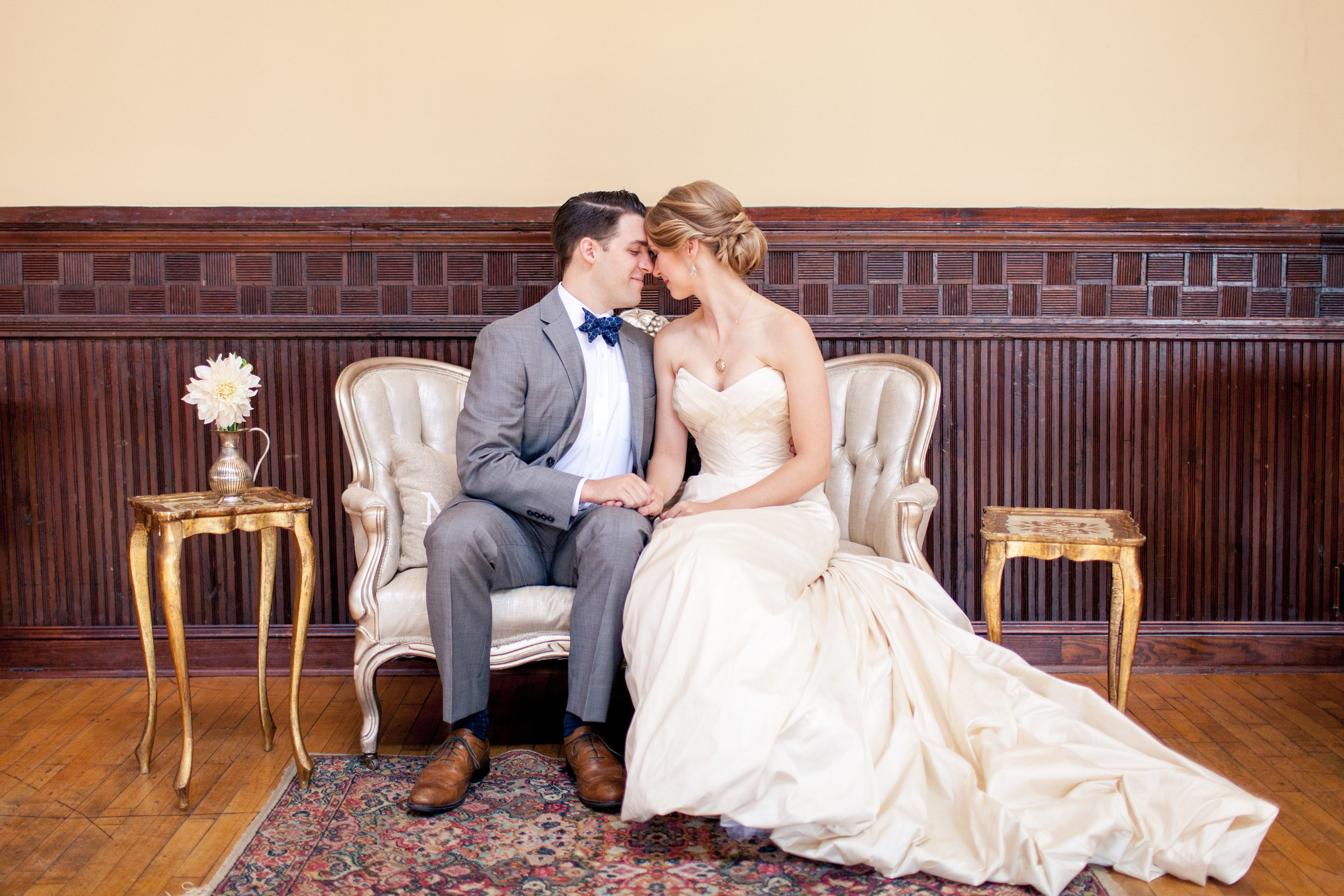 Instead of a sweetheart table, the bride and groom had their own a sweetheart lounge area situated right next to the dance floor. A sweet spot for them to rest, snuggle, sip, and people-watch. Their nook used our Lady Sybil love seat, Luciano side tables (gold florentine), Jess area rug, and some accent pillows.