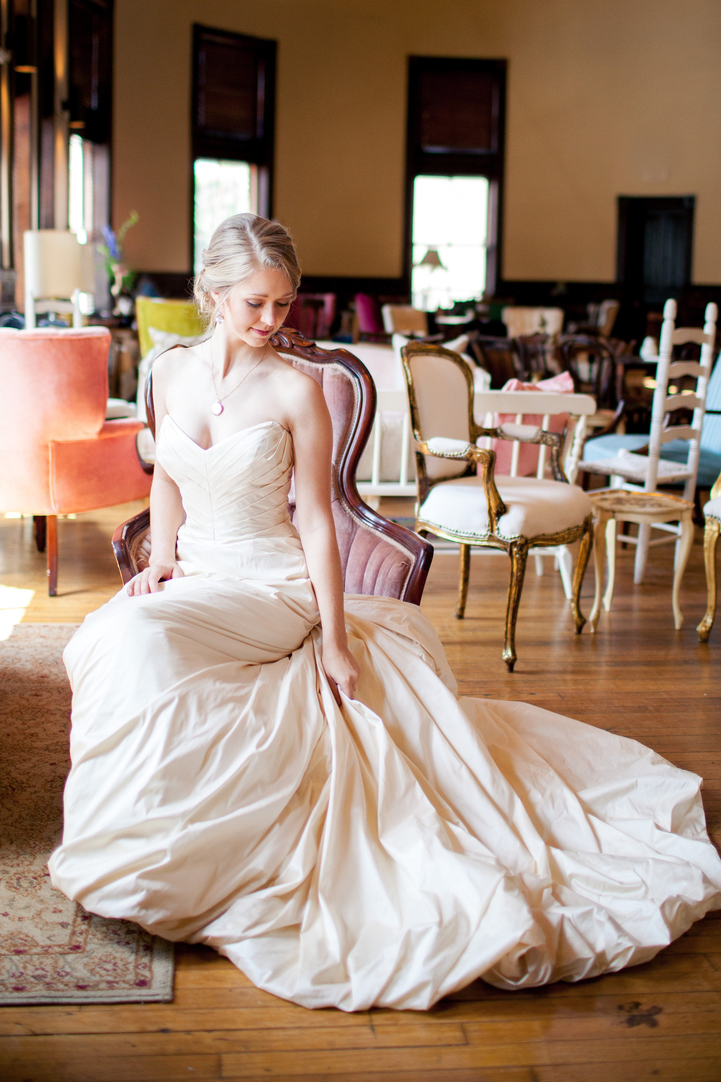 Elena looks stunning in her wedding gown from Fabulous Frocks of Atlanta sitting in her favorite chair in our collection, Elizabeth.