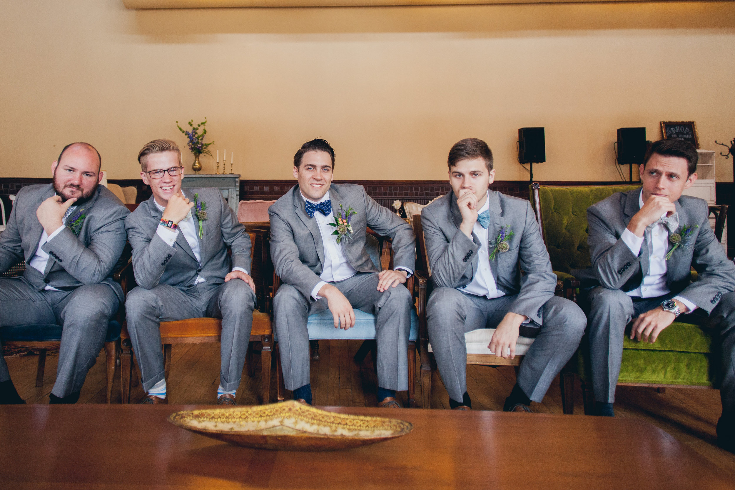 Handsome groom and groomsmen in our mod chair collection. 