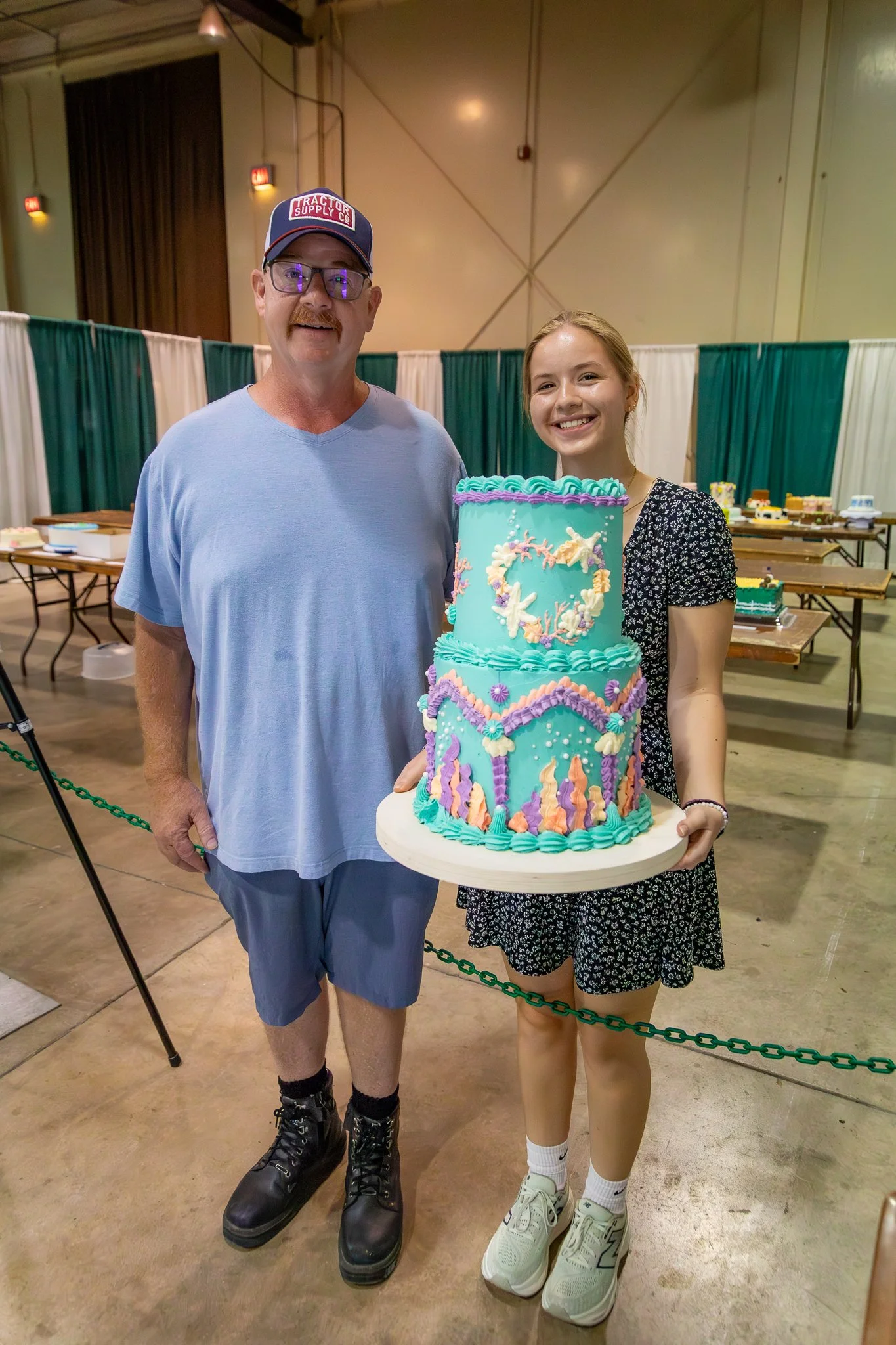"Creative Arts Competition" Jeff Flickinger and daughter/4H member Josi from Perry County presents her cake. The Ohio State Fair. Thursday July 24, 2025.