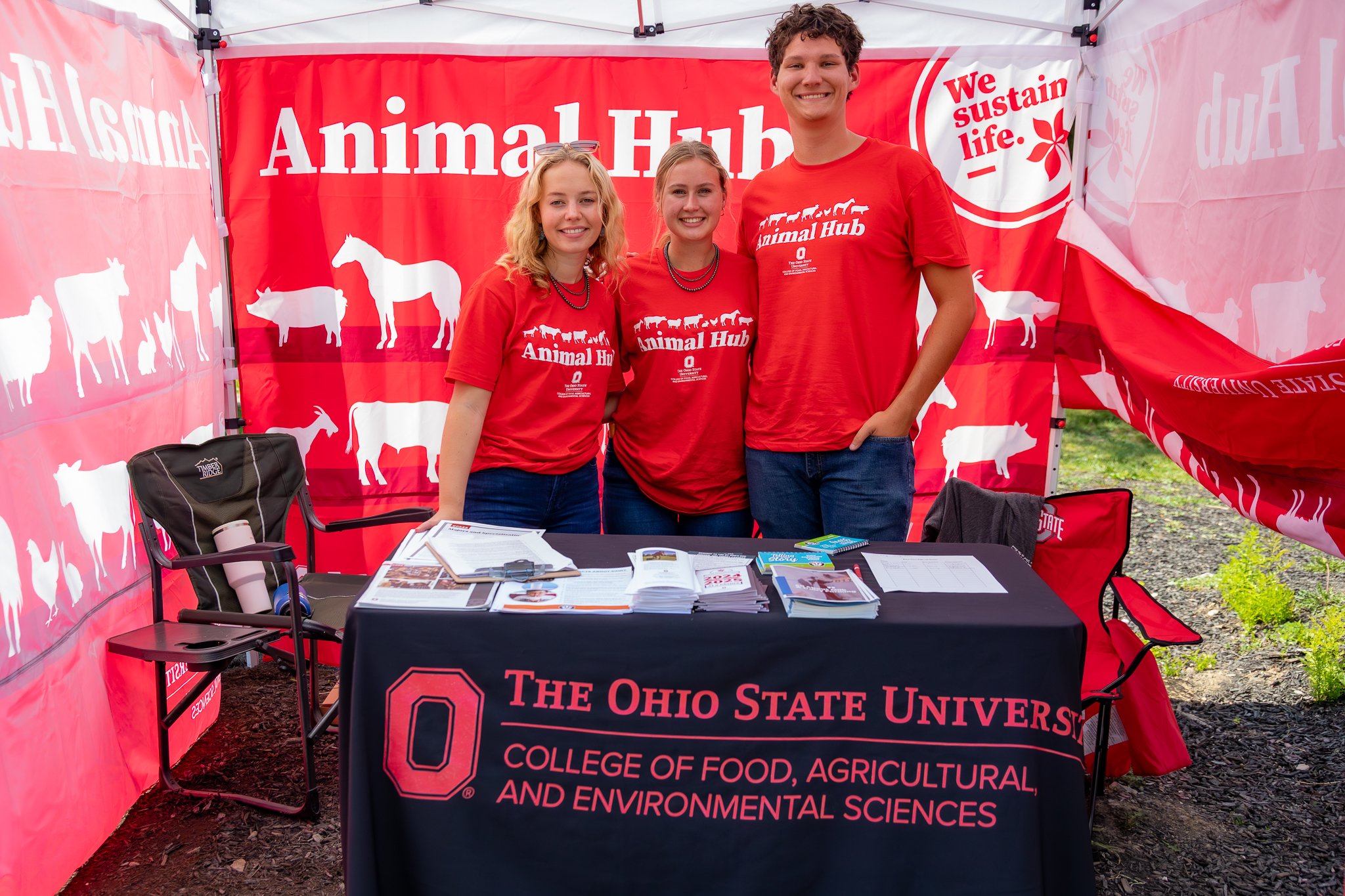 "Animal Science Majors" Abbie Sapp, Emma Irvin, and Zach Walker staff the OSU CFAES booth.  The Ohio State Fair. Thursday July 24, 2025.