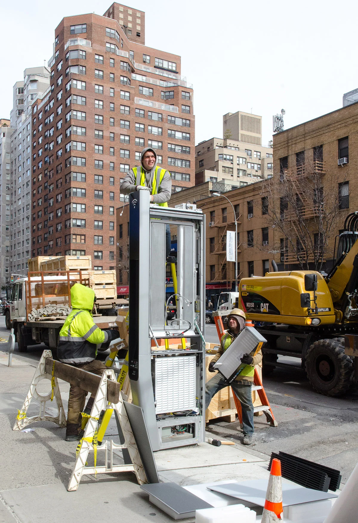 Phone booth of the 21st century. LinkNYC going in on the Upper East Side, NYC.