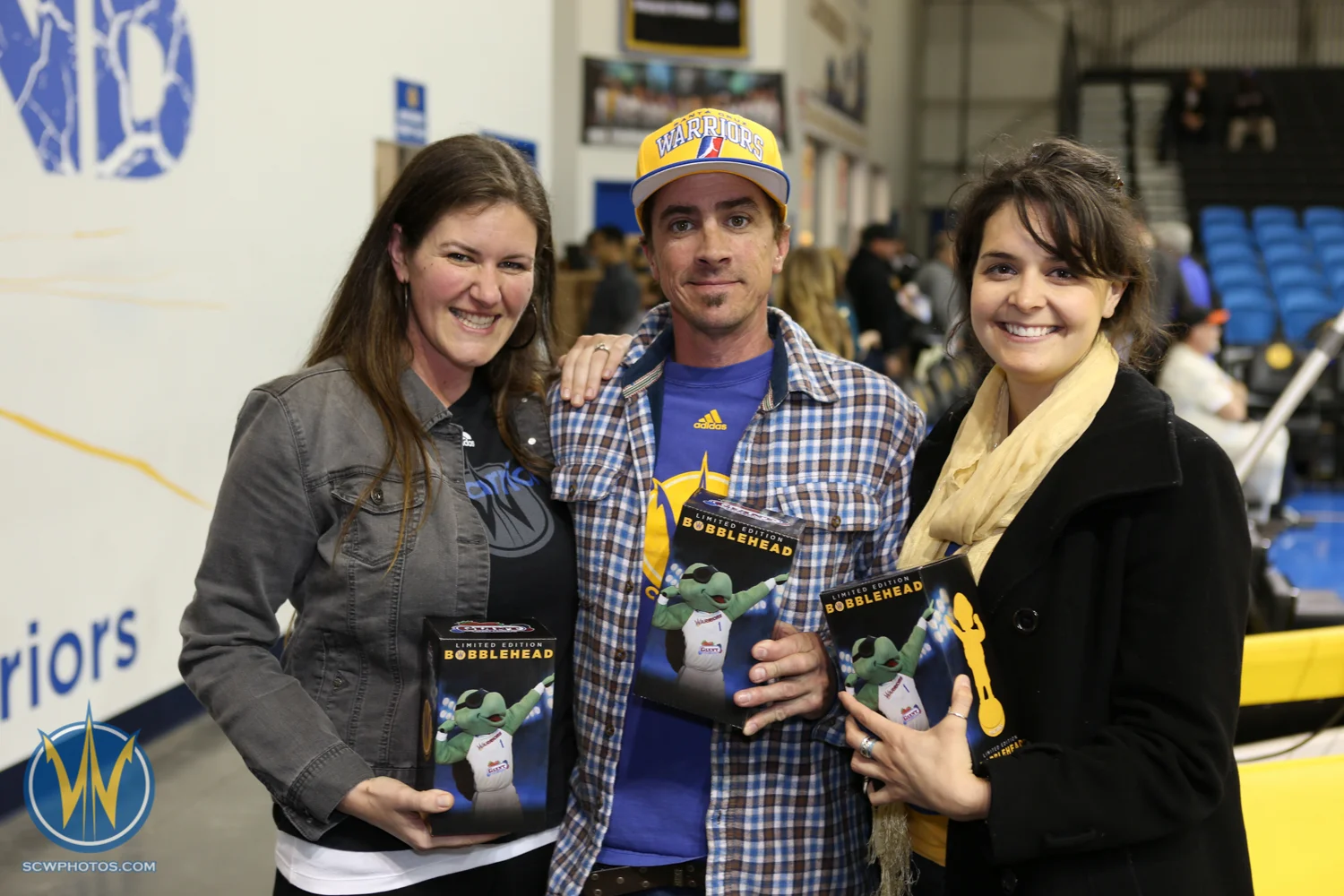 Fans pose with their new Mav'Riks bobble head presented by California Giant Berry Farms at the Santa Cruz Warriors game on February, 10, 2015 at Kaiser Permanente Arena in Santa Cruz, California. (Photo: Tim Cattera Photography/SC Warriors 2015)