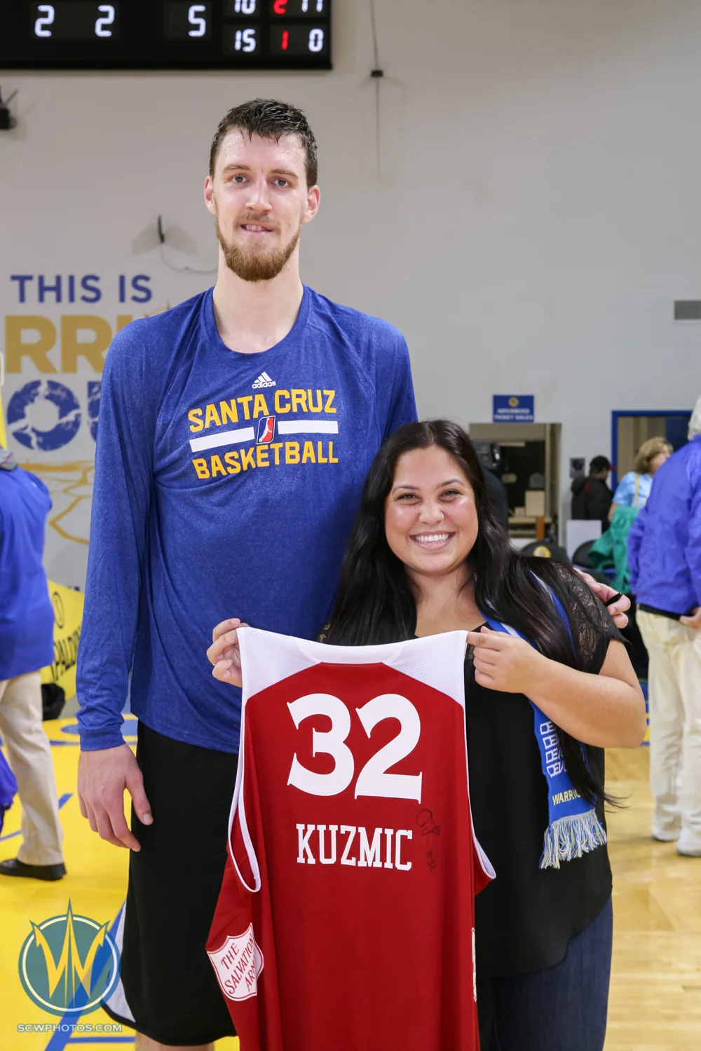 Jersey Auction winners pose with their favorite player at the Santa Cruz Warriors game on December 17, 2014 at Kaiser Permanente Arena in Santa Cruz, California. (Photo: Tim Cattera Photography/SC Warriors 2014)