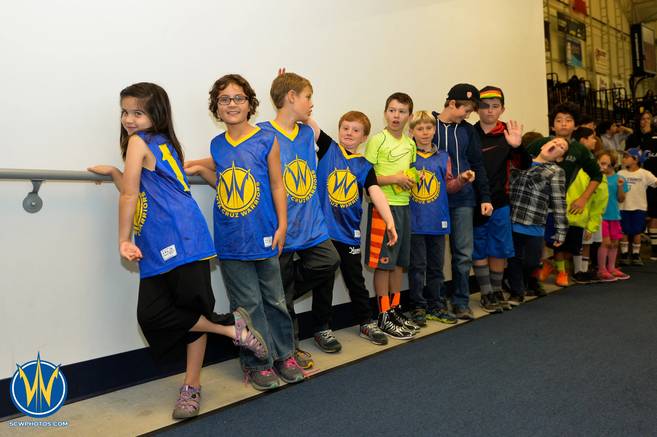 Warriors fans having fun in the High Five Fan Tunnel at the Santa Cruz Warriors game on 12/19/15 at Kaiser Permanente Arena in Santa Cruz, California. (Photo: (Pasag Photography)/ SC Warriors 2015) 