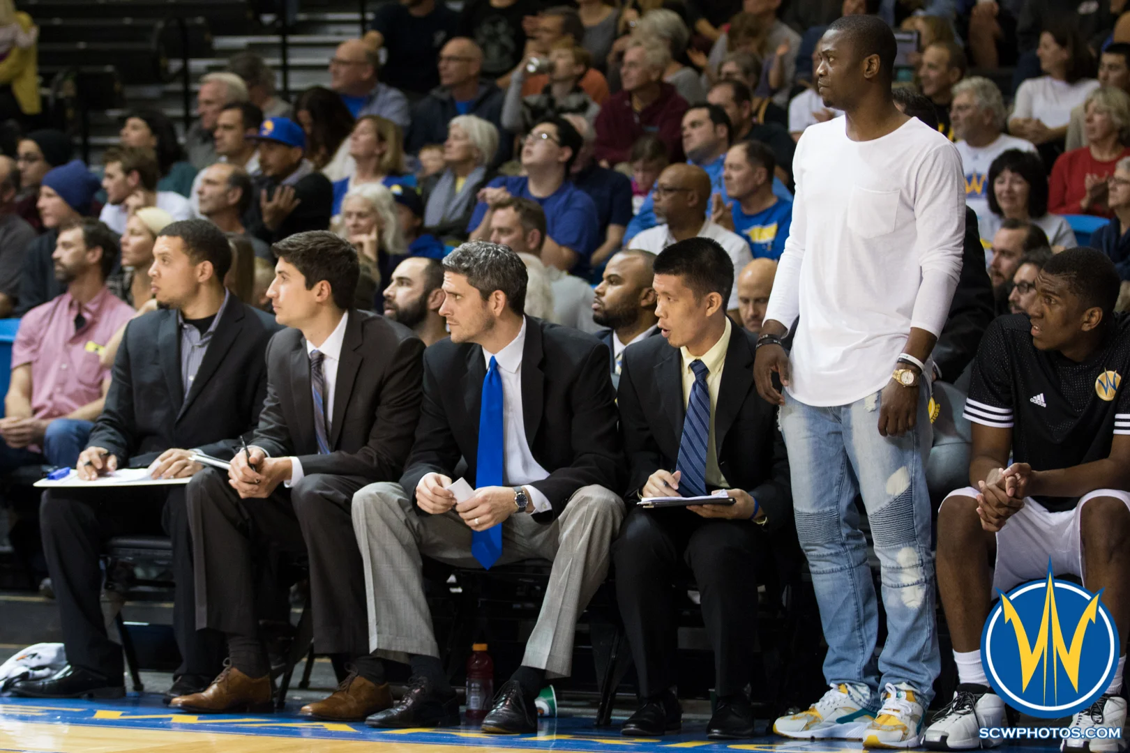 Maurice Bakers stands and watches the game with the rest of the Warriors coaching staff at Kaiser Permanente Arena on January 20, 2016 (Photo: Ariel Nava Photography)