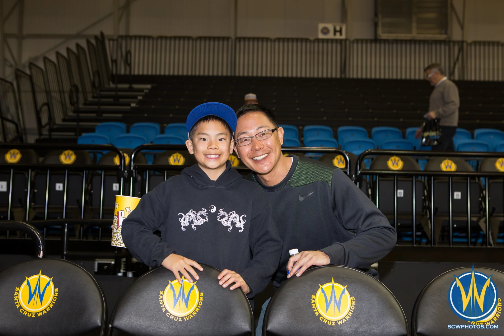Two Santa Cruz Warriors fans ready to watch the Warriors play basketball at Kaiser Permanente Arena on February 19, 2016 (Photo: Ariel Nava Photography)