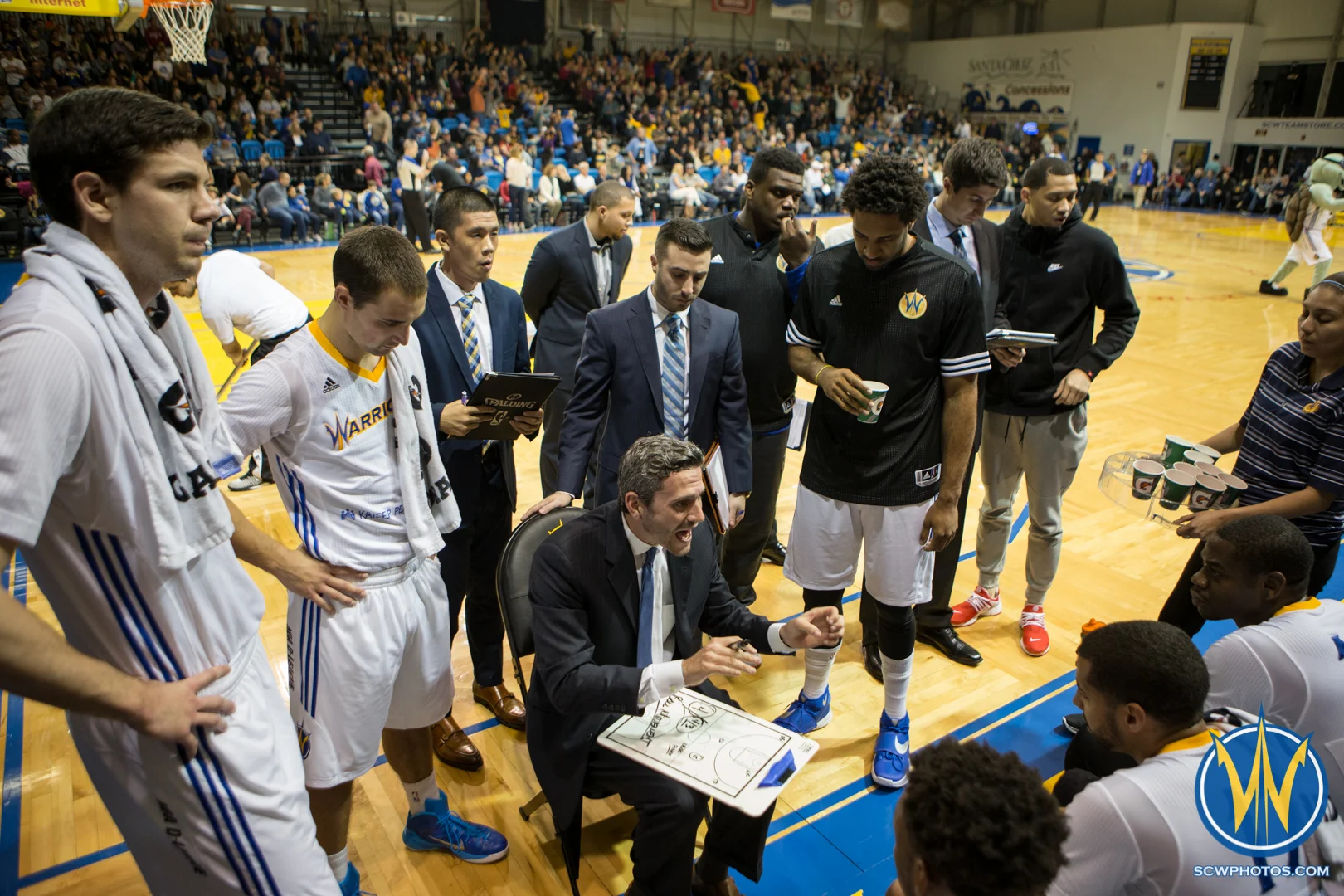 Coach Hill gives instructions to the players during a timeout at Kaiser Permanente Arena on February 19, 2016 (Photo: Ariel Nava Photography)